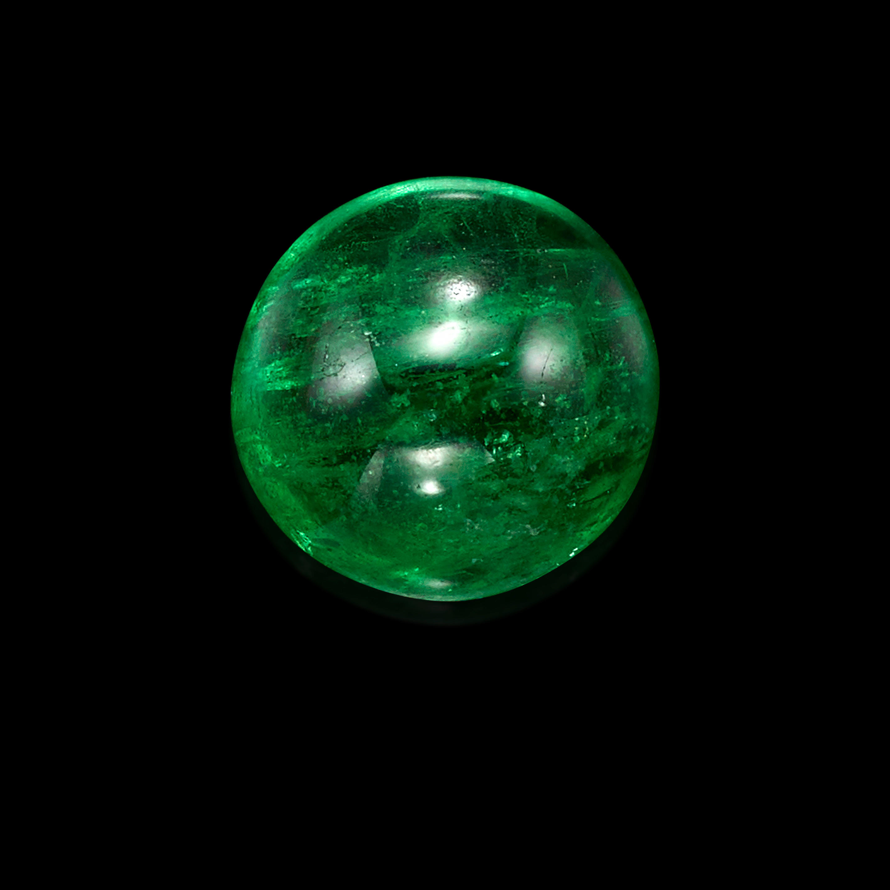 Appraisal: TSAVORITE CABOCHON Kenya A round tsavorite cabochon exhibiting vivid spinach