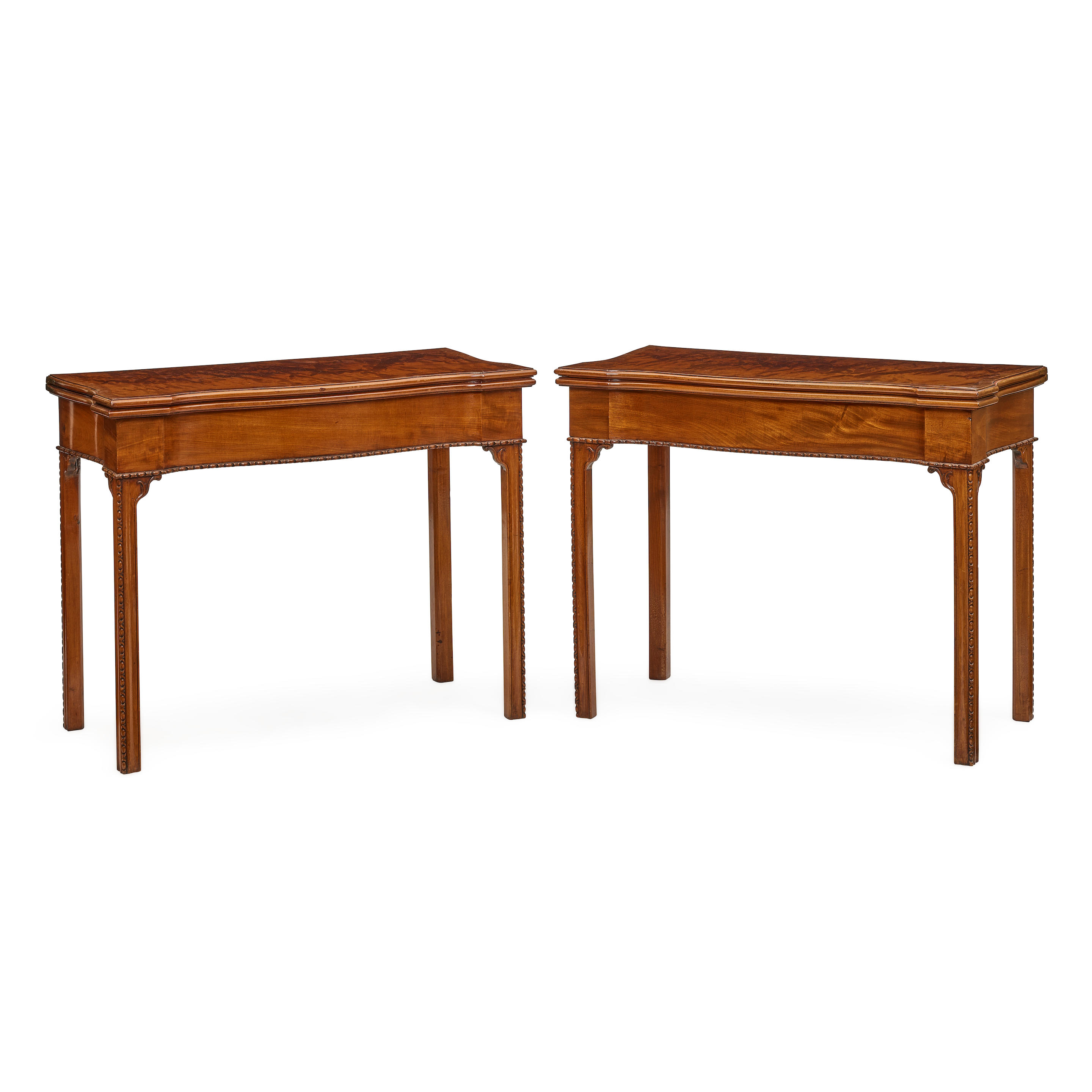 Appraisal: A PAIR OF GEORGE III MAHOGANY FOLD OVER GAMES TABLES