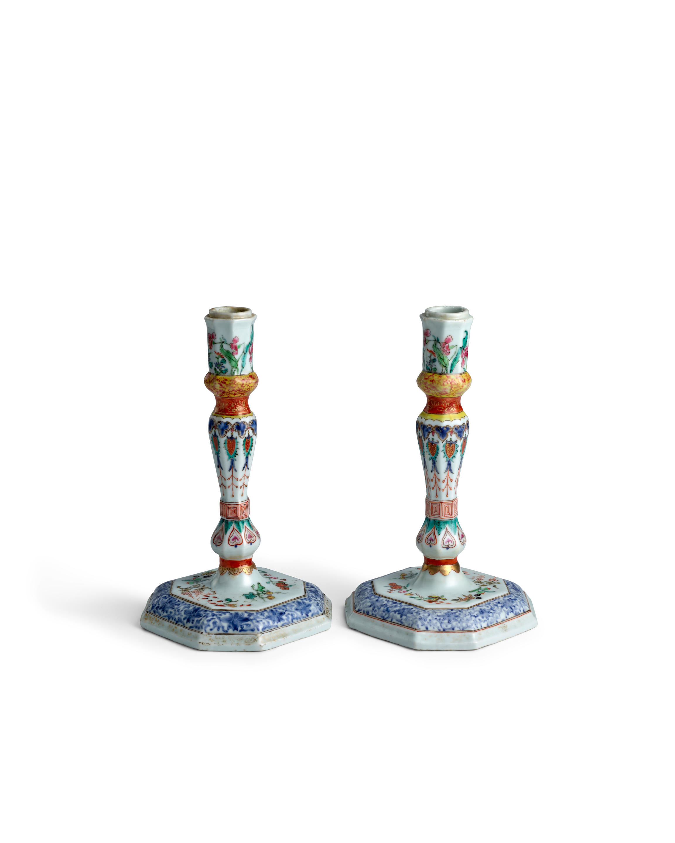 Appraisal: A RARE PAIR OF FAMILLE ROSE OCTAGONAL EUROPEAN-SILVER-SHAPED CANDLESTICKS Qianlong