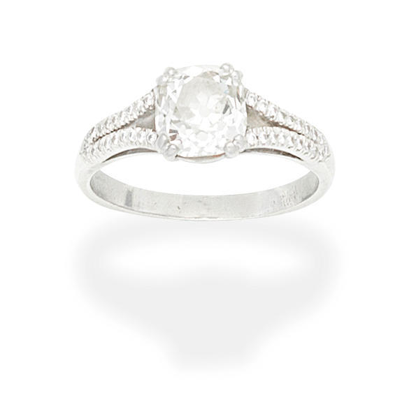 Appraisal: DIAMOND SINGLE-STONE RING Set with a cushion-shaped diamond between bifurcated