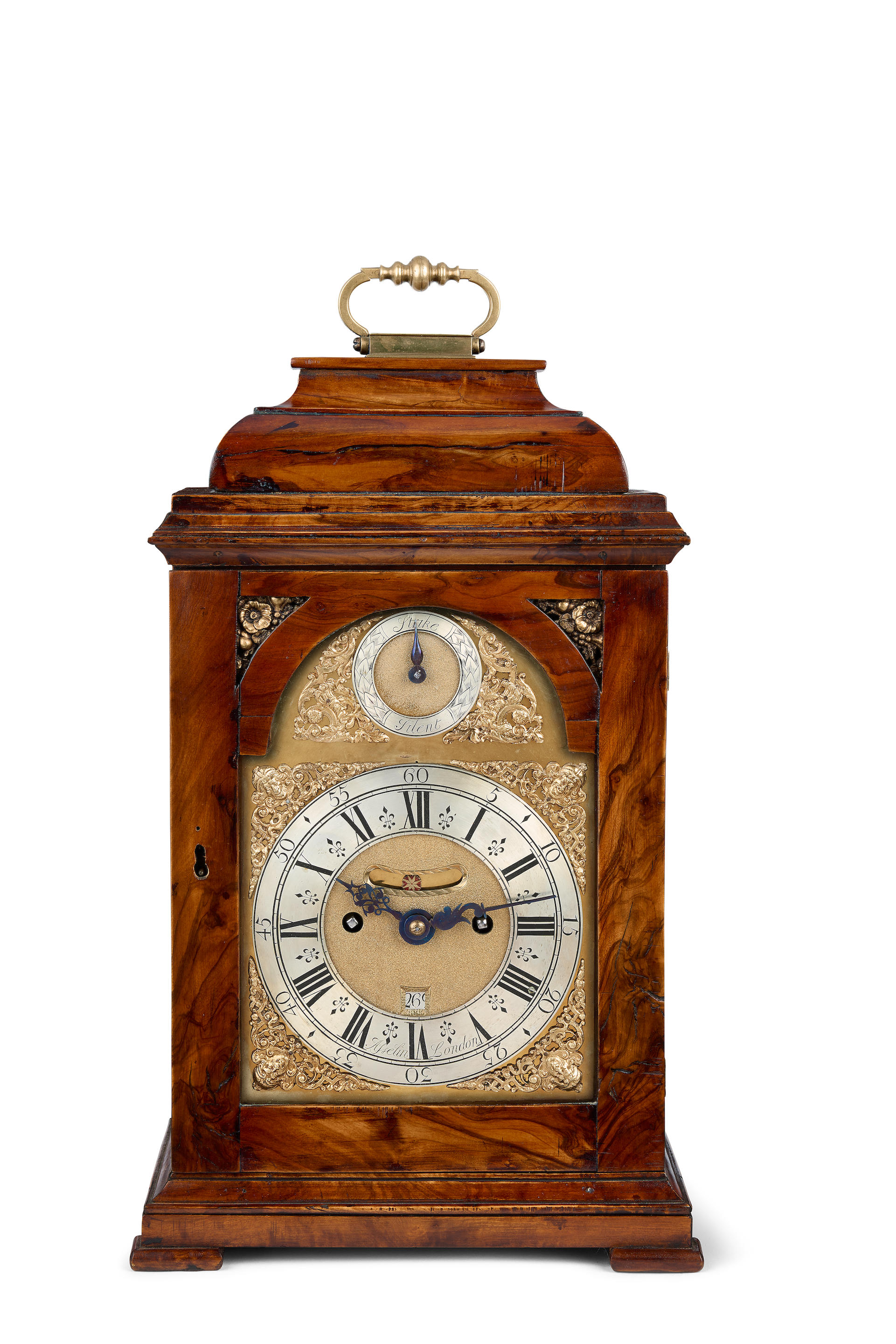 Appraisal: A MID TH CENTURY TABLE CLOCK IN A RE-VENNERED OLIVEWOOD