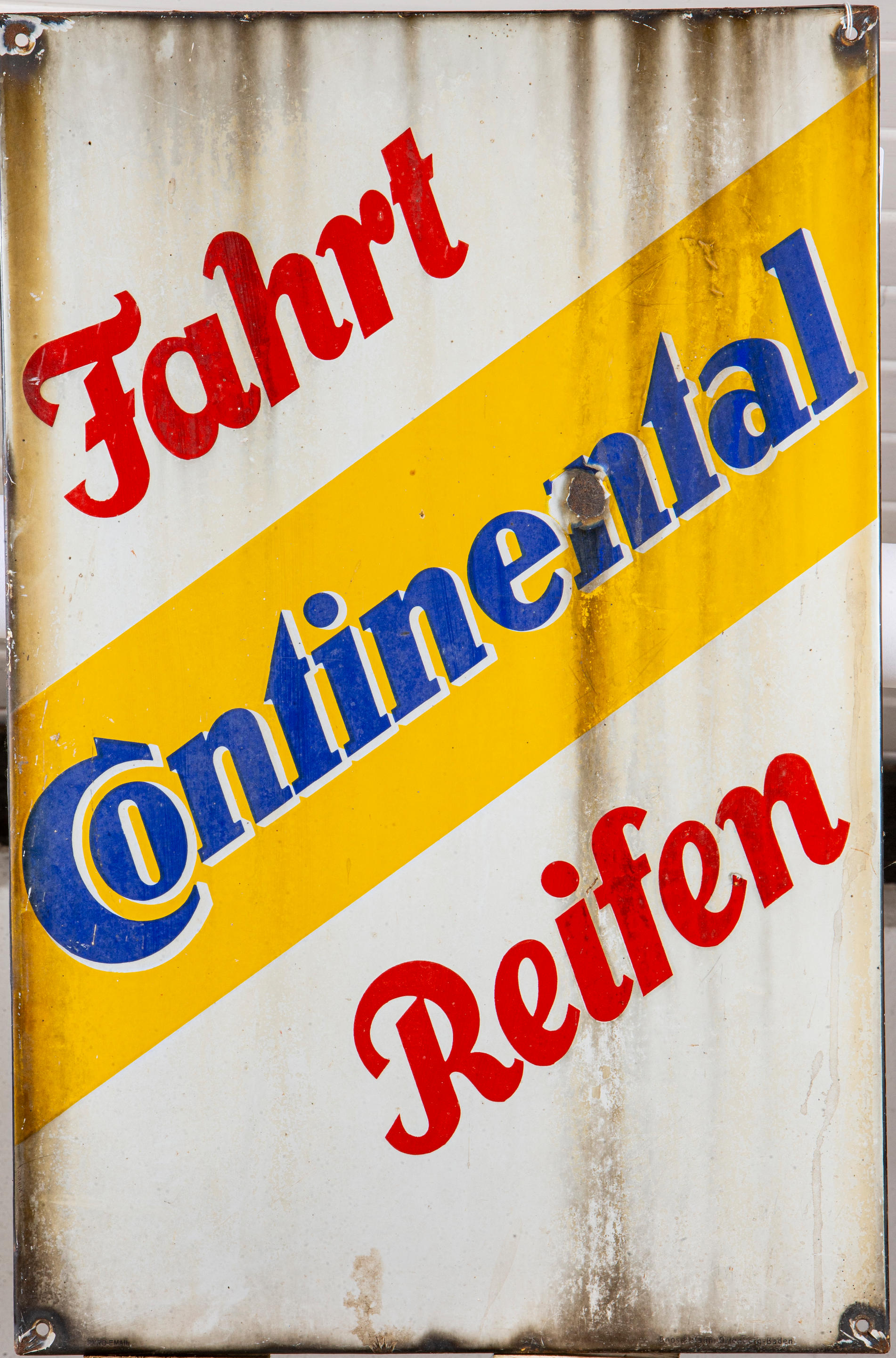 Appraisal: A CONTINENTAL ENAMEL ADVERTISING SIGN in red white blue and