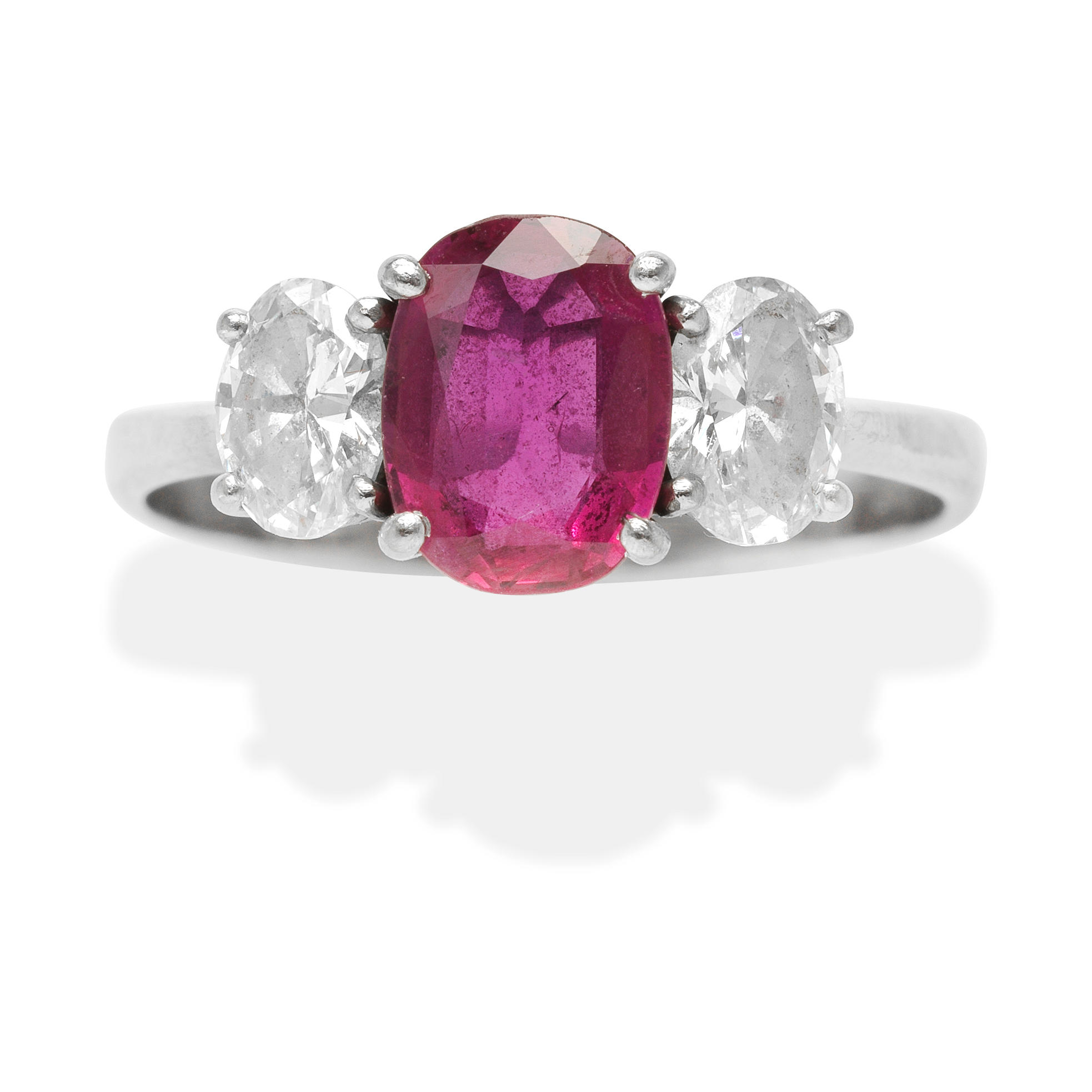 Appraisal: RUBY AND DIAMOND RING The oval-cut ruby between oval-cut diamonds