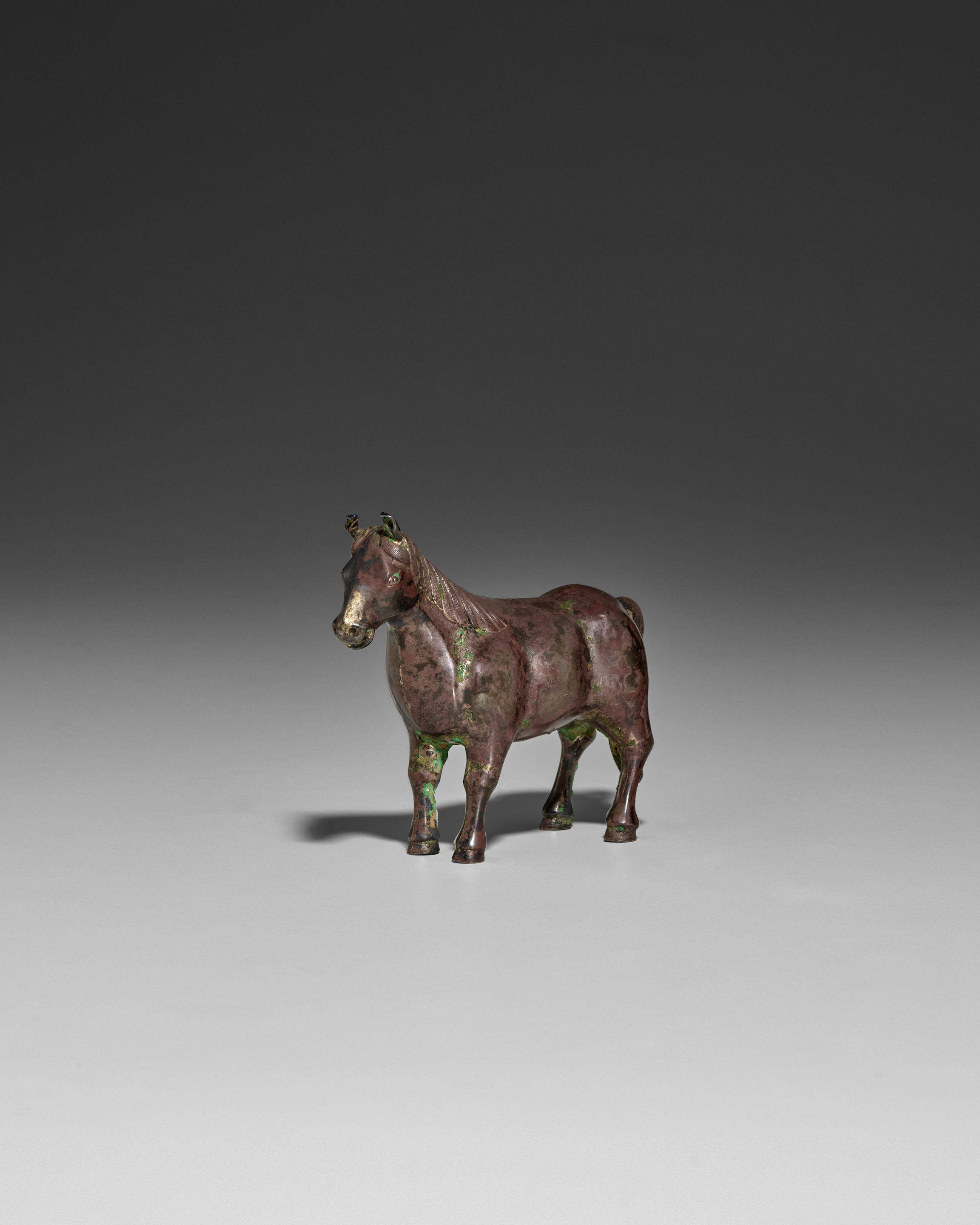 Appraisal: A CAST SILVER MINIATURE FIGURE OF A HORSE Qing dynasty