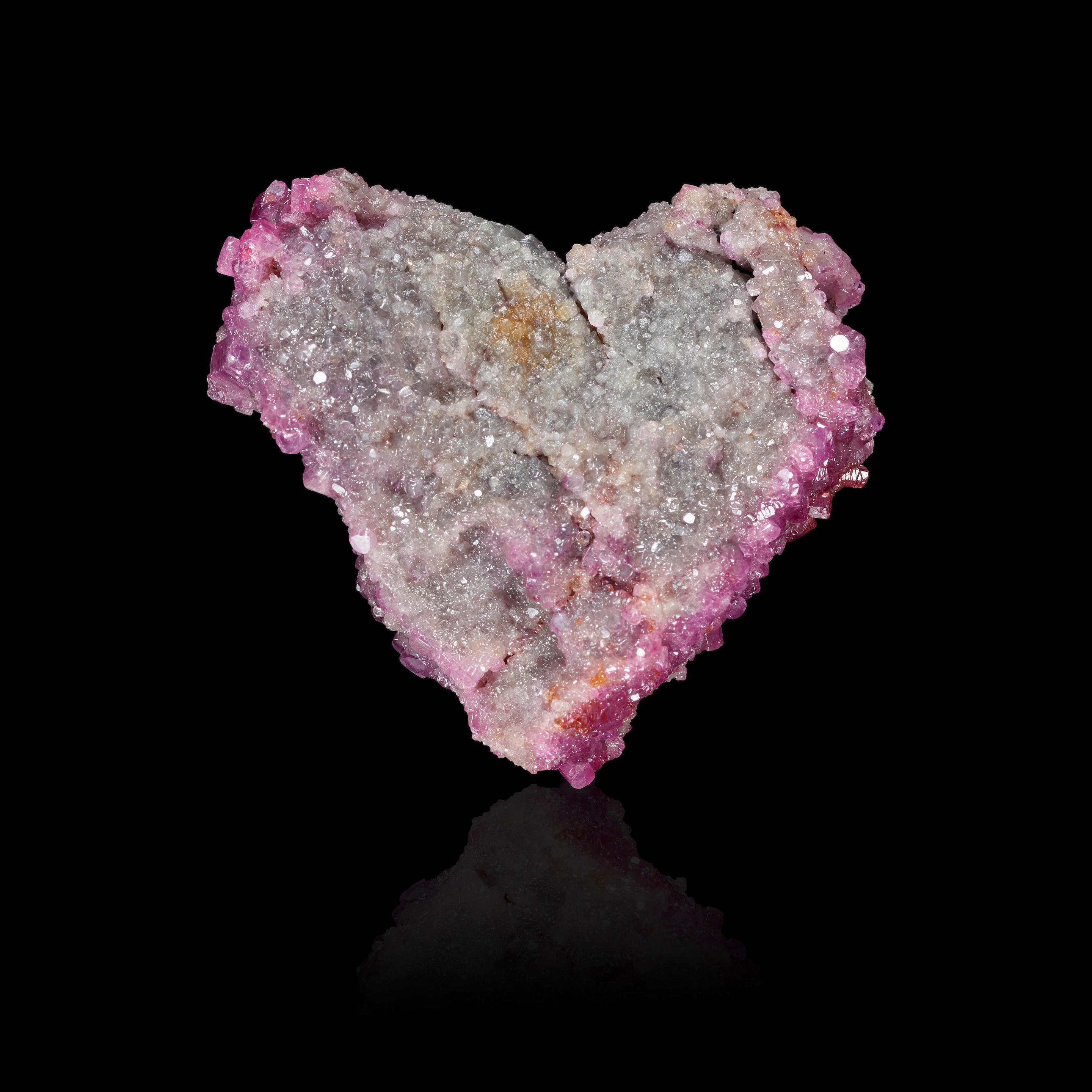 Appraisal: HEART-SHAPED CORUNDUM CRYSTAL Mogok Burma This heart-shaped crystal formed with