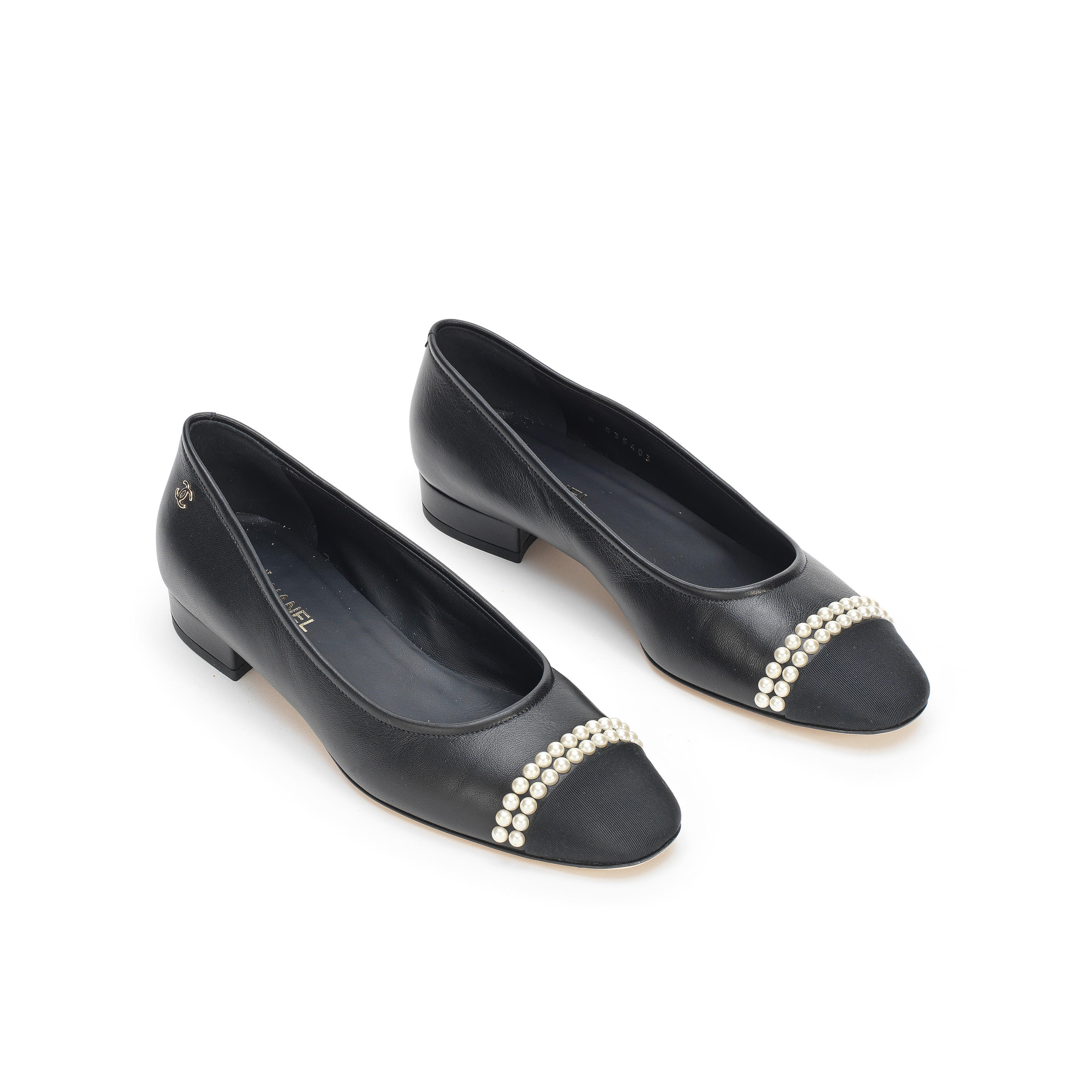 Appraisal: A PAIR OF BLACK PUMPS WITH PEARL DETAILS Chanel Black