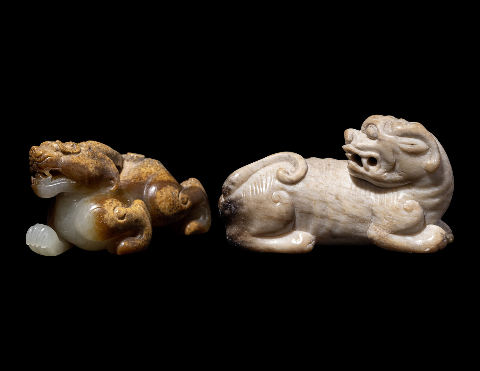 Appraisal: Two Chinese Jade Figures of Mythical Beasts the first a