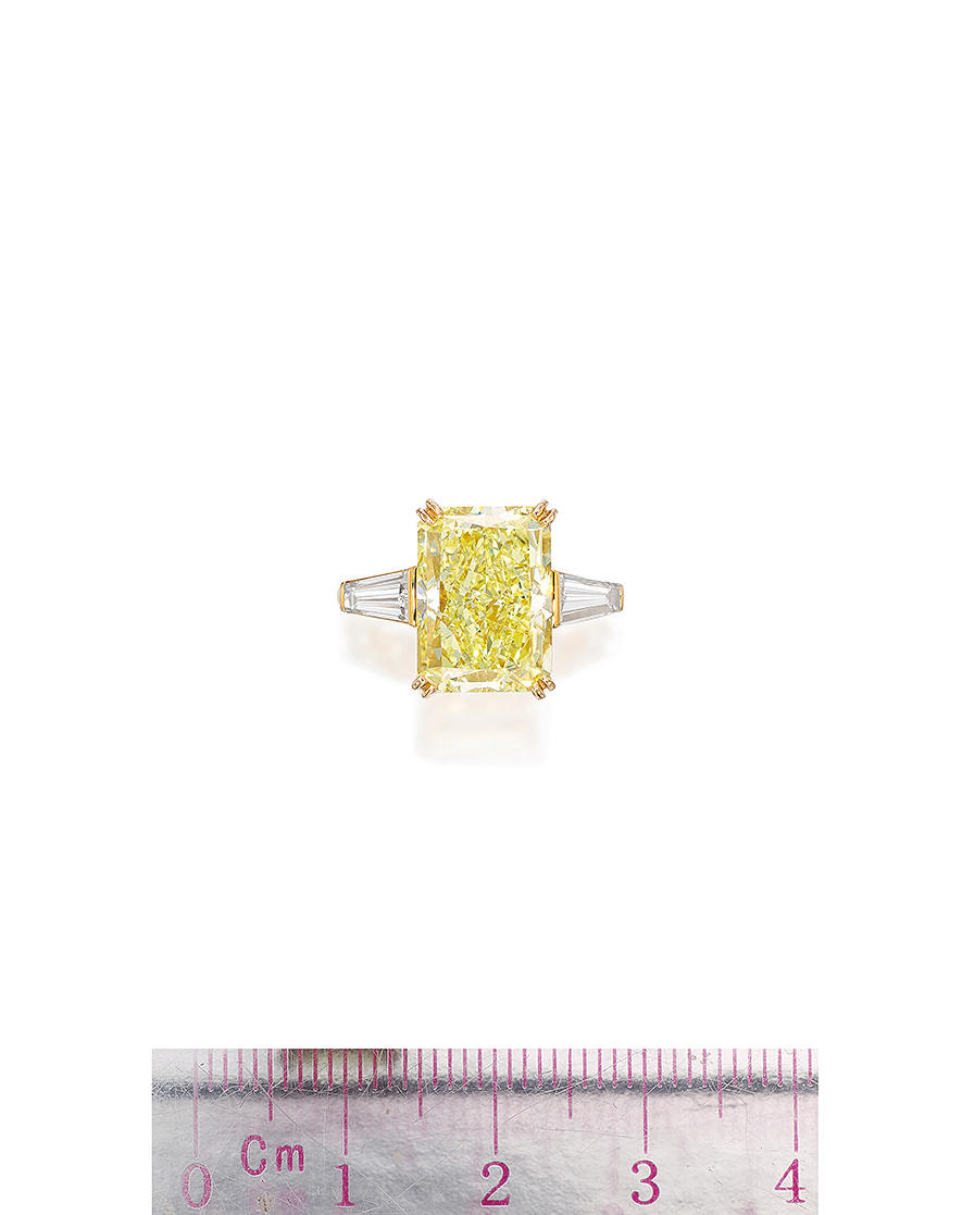 Appraisal: BOUCHERON FANCY YELLOW DIAMOND AND DIAMOND RING The radiant-cut fancy