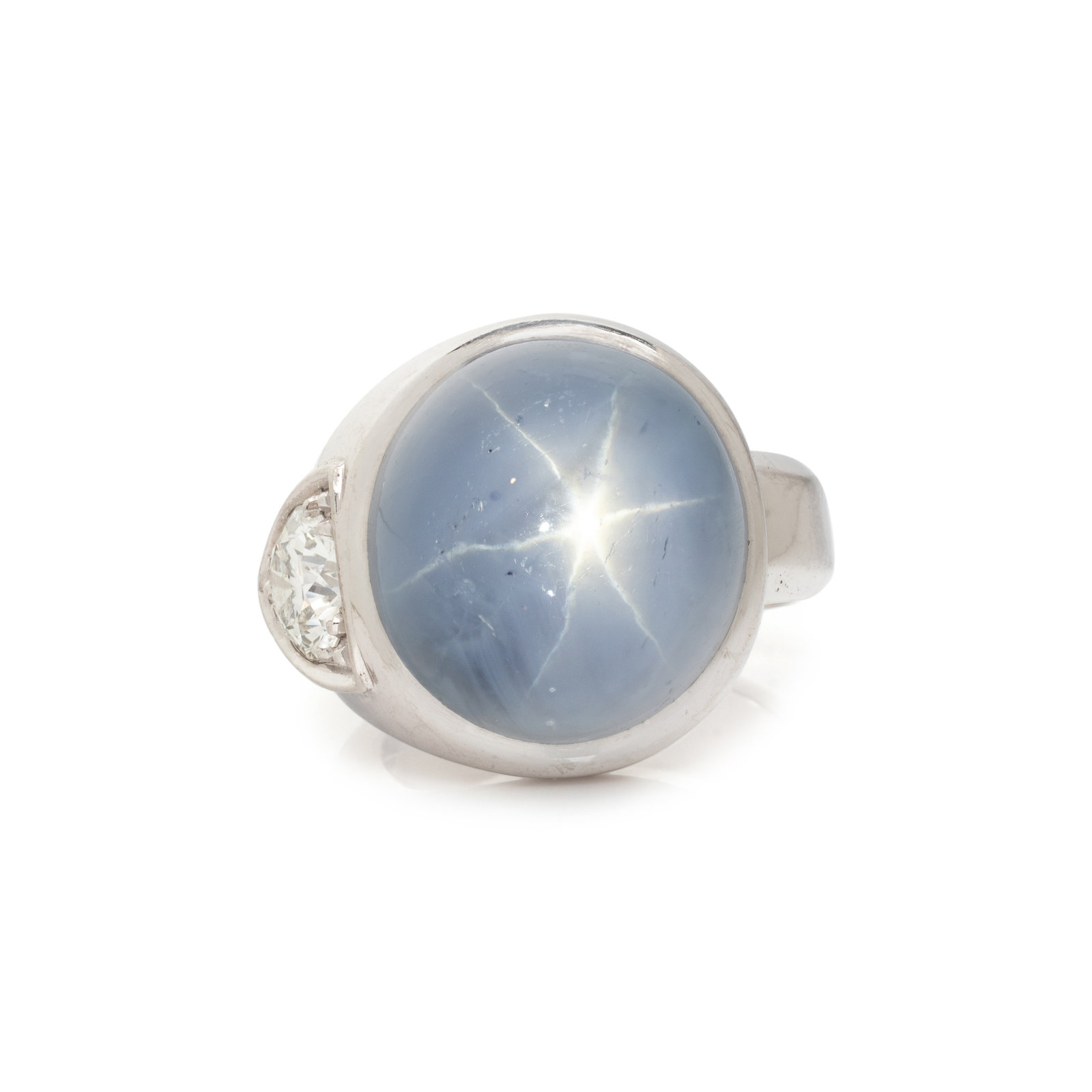 Appraisal: STAR SAPPHIRE AND DIAMOND RING Oval cabochon star sapphire measuring