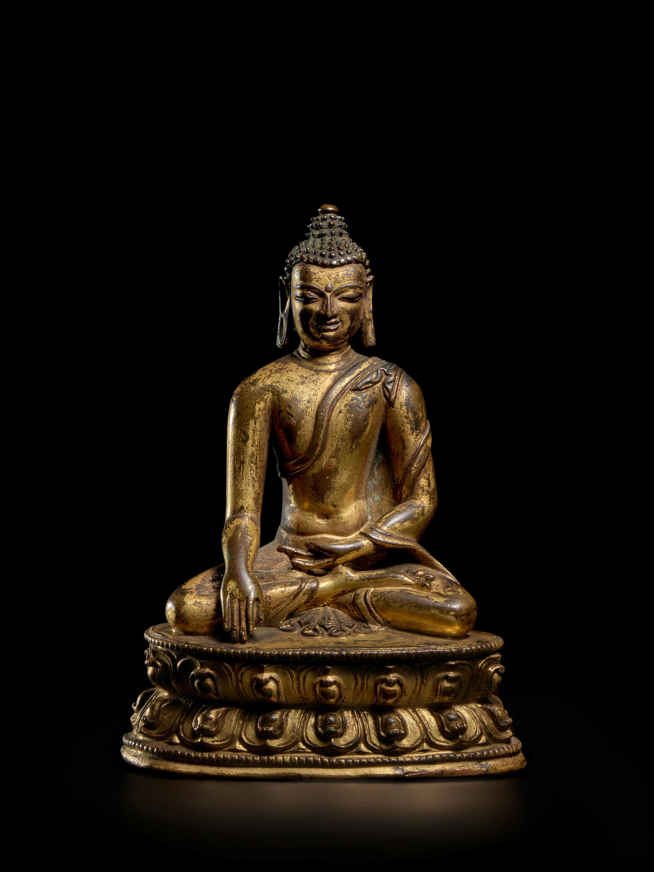 Appraisal: A GILT COPPER ALLOY FIGURE OF BUDDHA TIBET TH TH