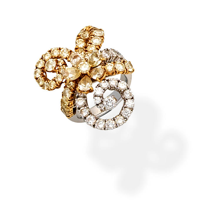 Appraisal: DIAMOND AND COLOURED DIAMOND DRESS RING Of floral and swirl