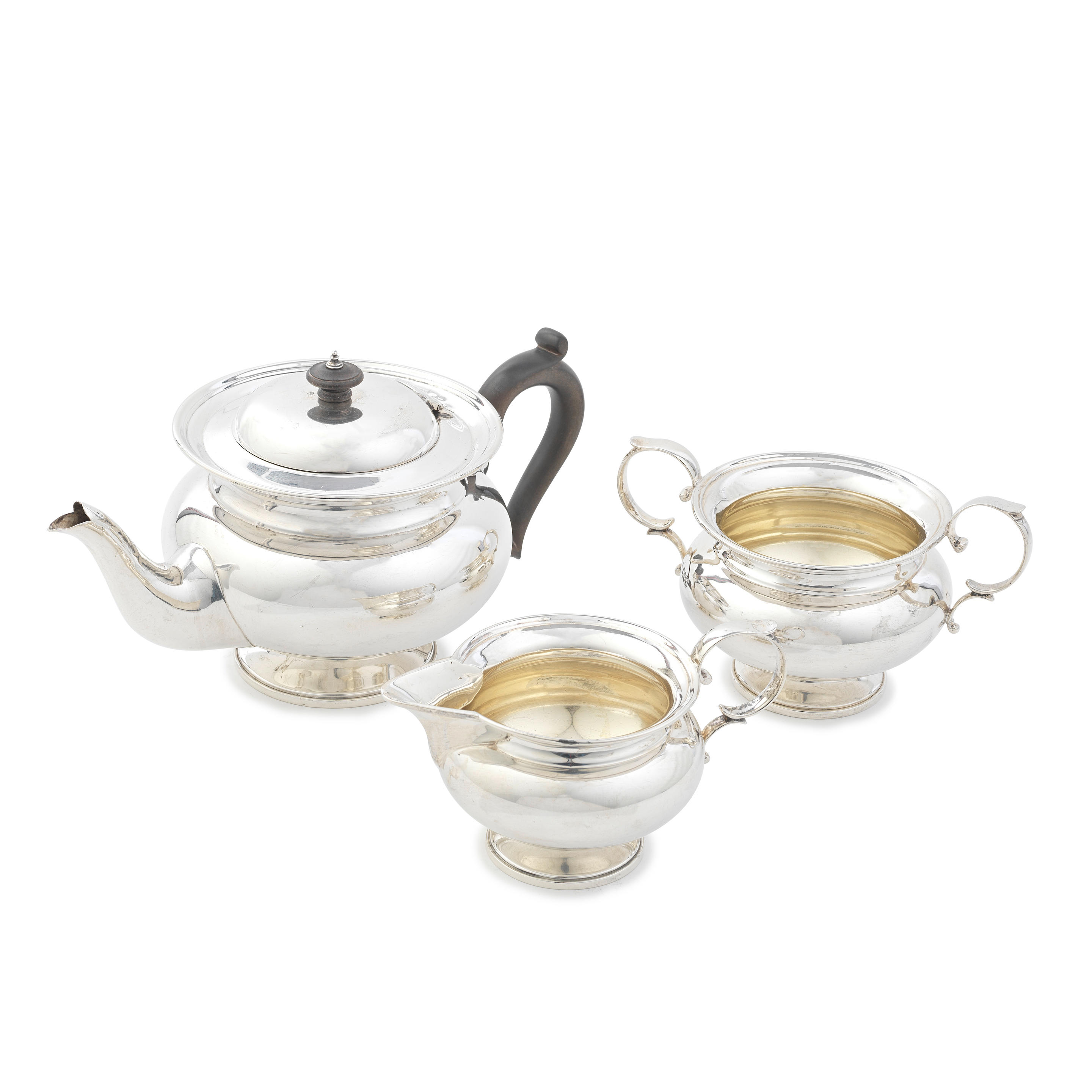 Appraisal: A SILVER THREE-PIECE TEA SERVICE Charles Edwards London Plain compressed