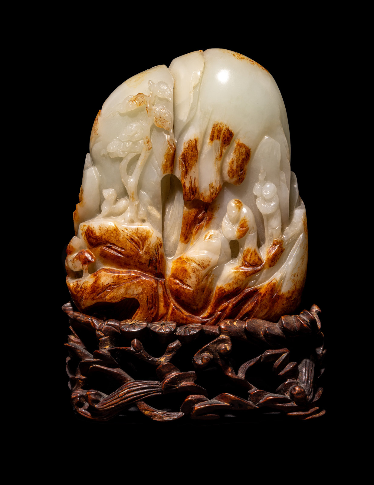 Appraisal: A Chinese Celadon and Russet Jade 'Landscape' Boulder Early th