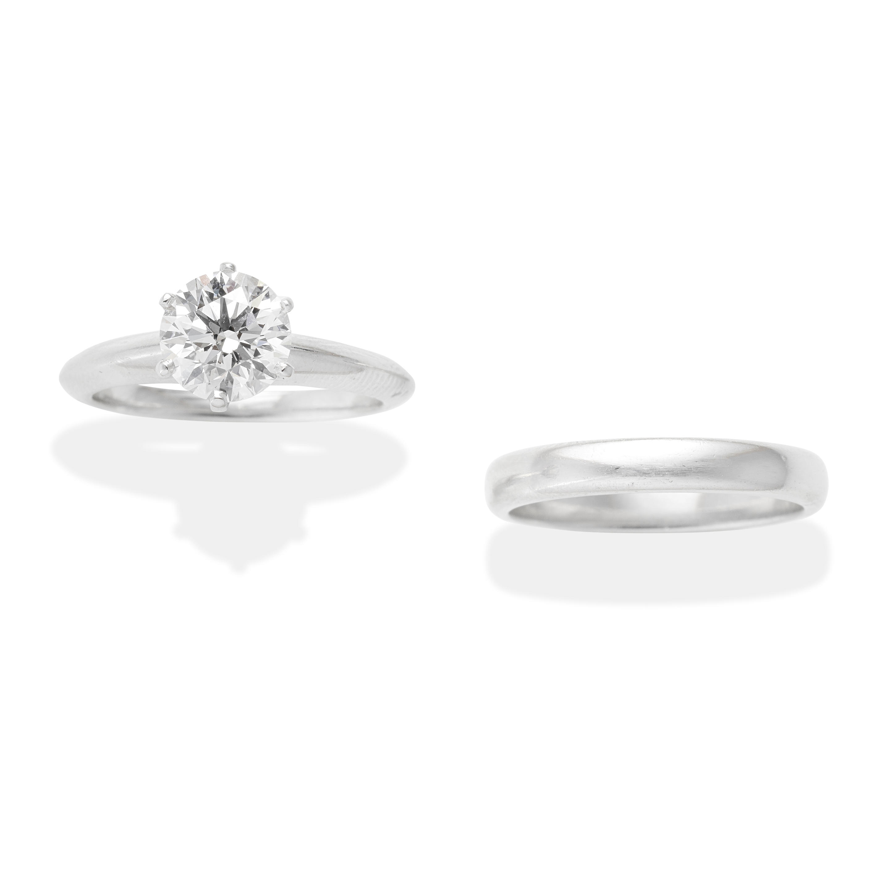 Appraisal: TIFFANY DIAMOND SINGLE-STONE RING AND WEDDING BAND Set with a