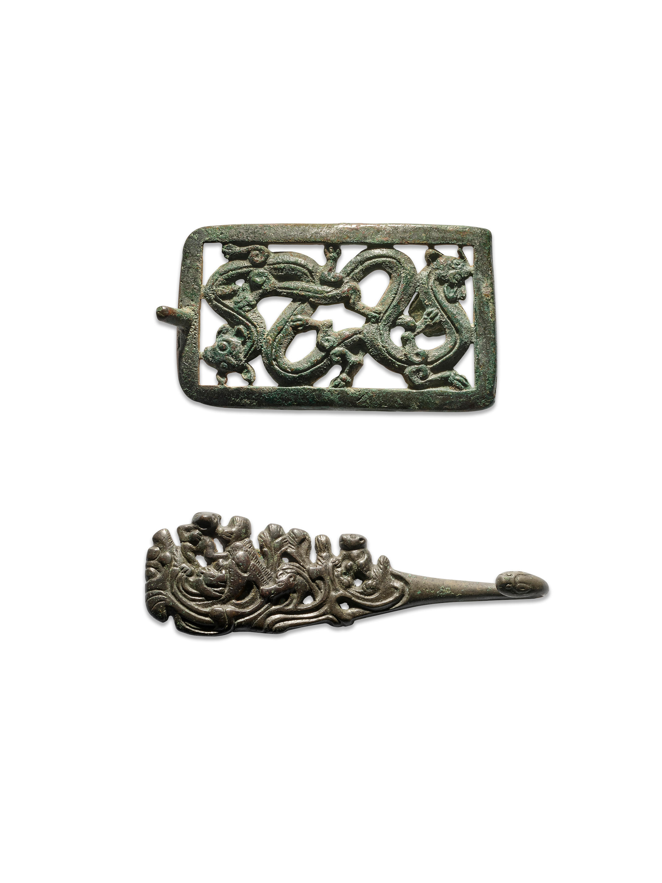 Appraisal: TWO RETICULATED BRONZE BELT BUCKLES Warring States Period and Han