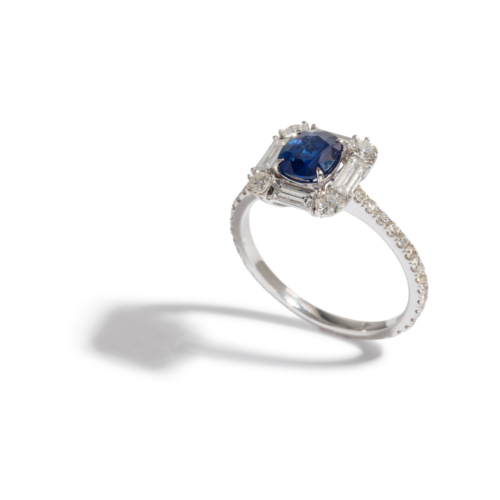 Appraisal: UNHEATED BURMESE SAPPHIRE AND DIAMOND RING Containing one oval mixed