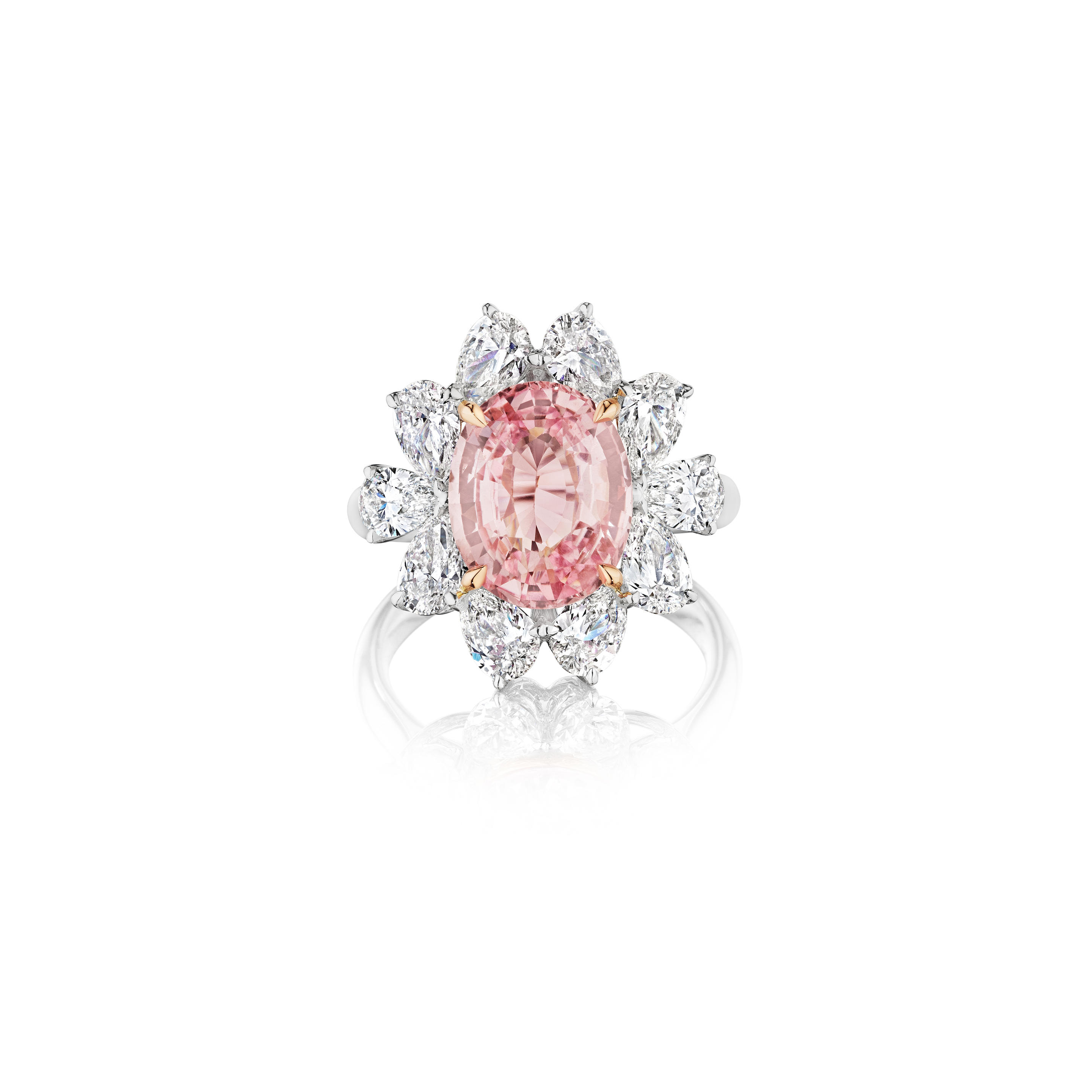 Appraisal: A PADPARADSCHA SAPPHIRE RING Centering an oval modified brilliant step-cut