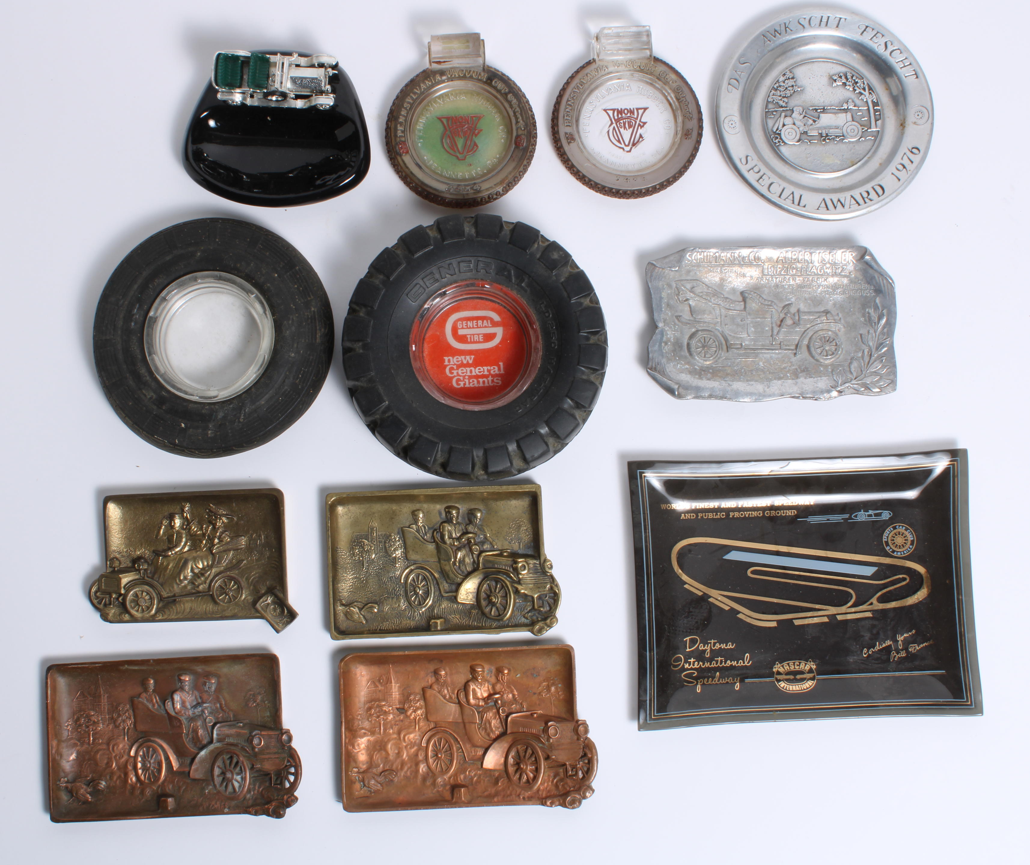 Appraisal: A COLLECTION OF MOTORING ASHTRAYS including Schumann Co two embossed