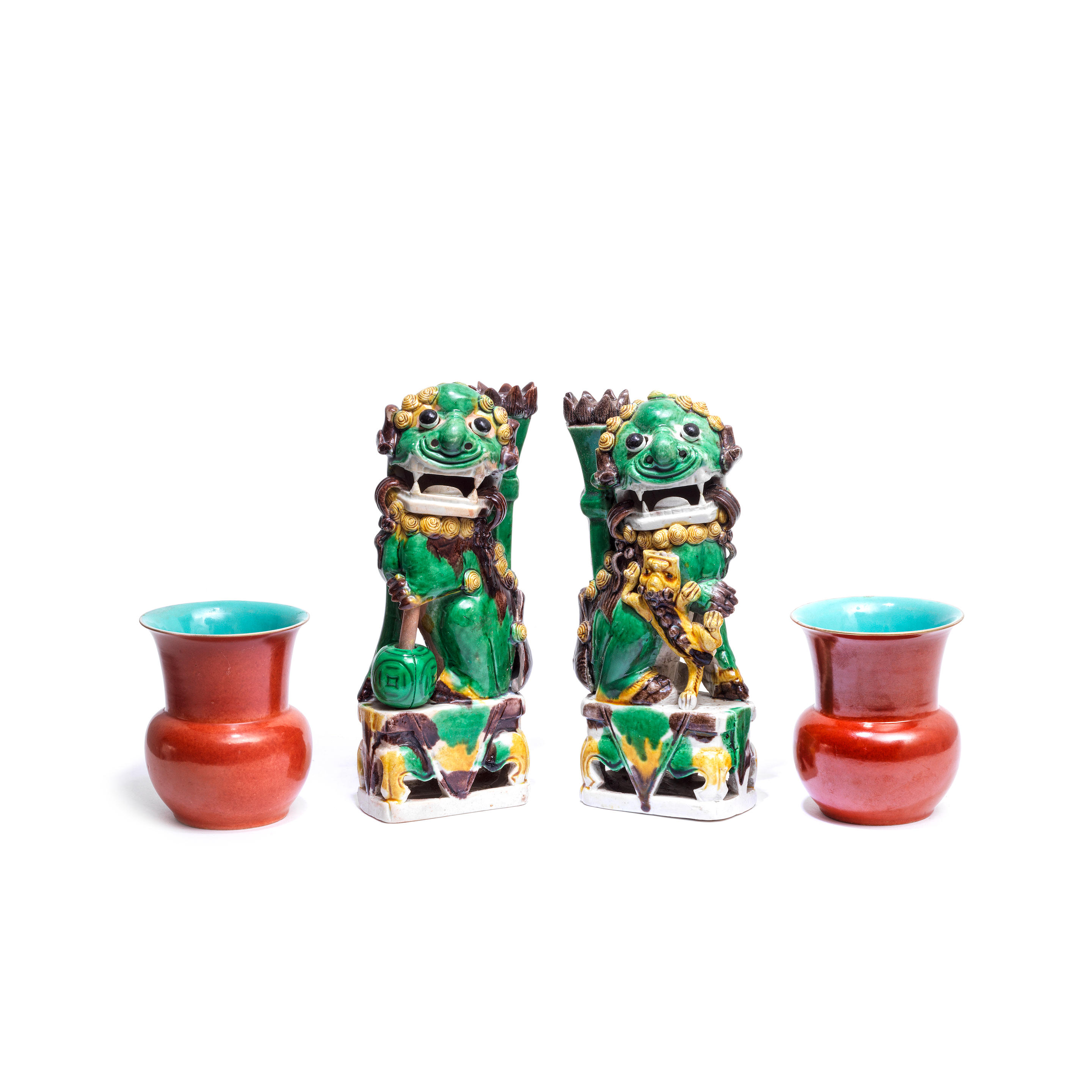 Appraisal: A PAIR OF FAMILLE VERTE BISCUIT 'LION' JOSS STICK HOLDERS