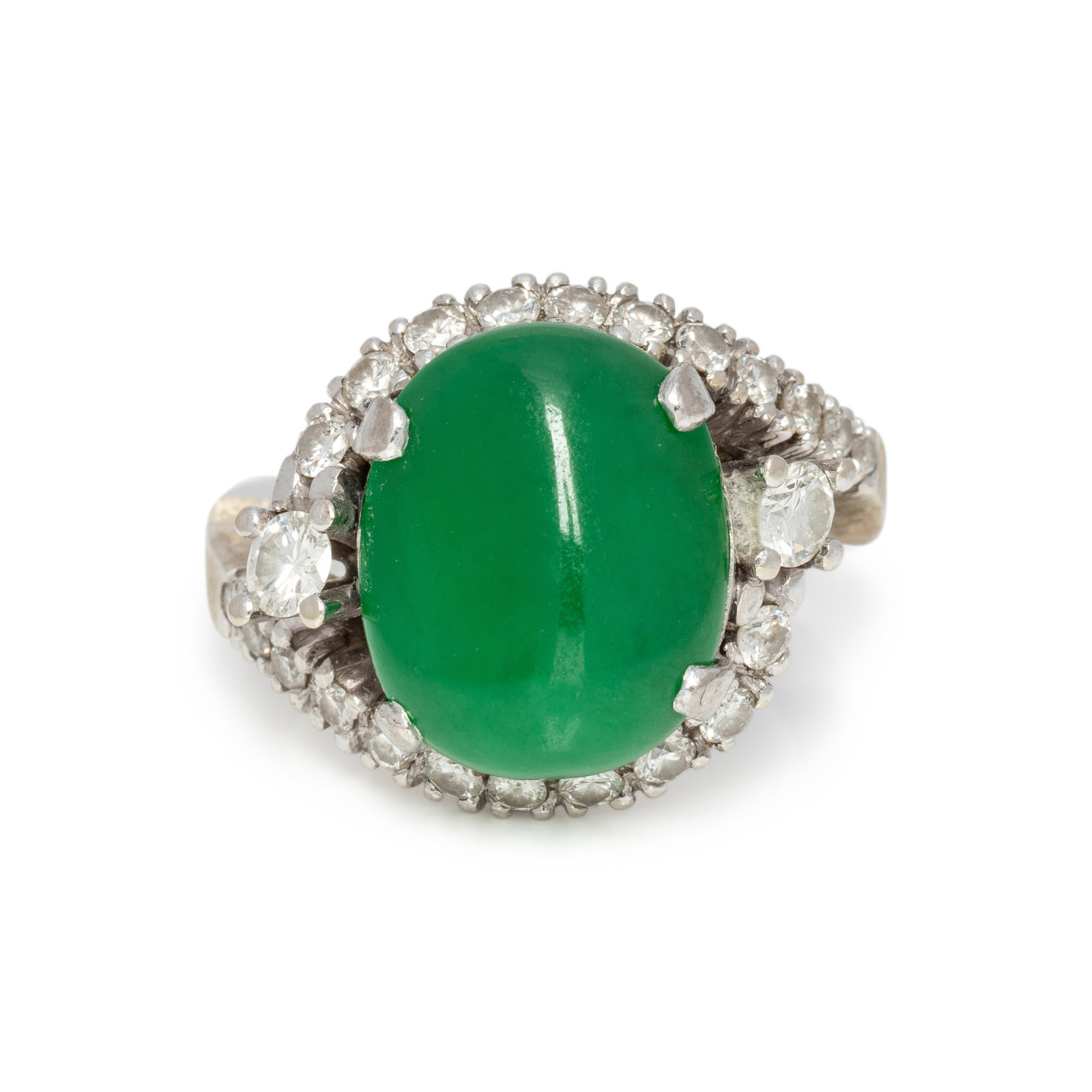 Appraisal: JADE AND DIAMOND RING Containing one freeform jade measuring approximately