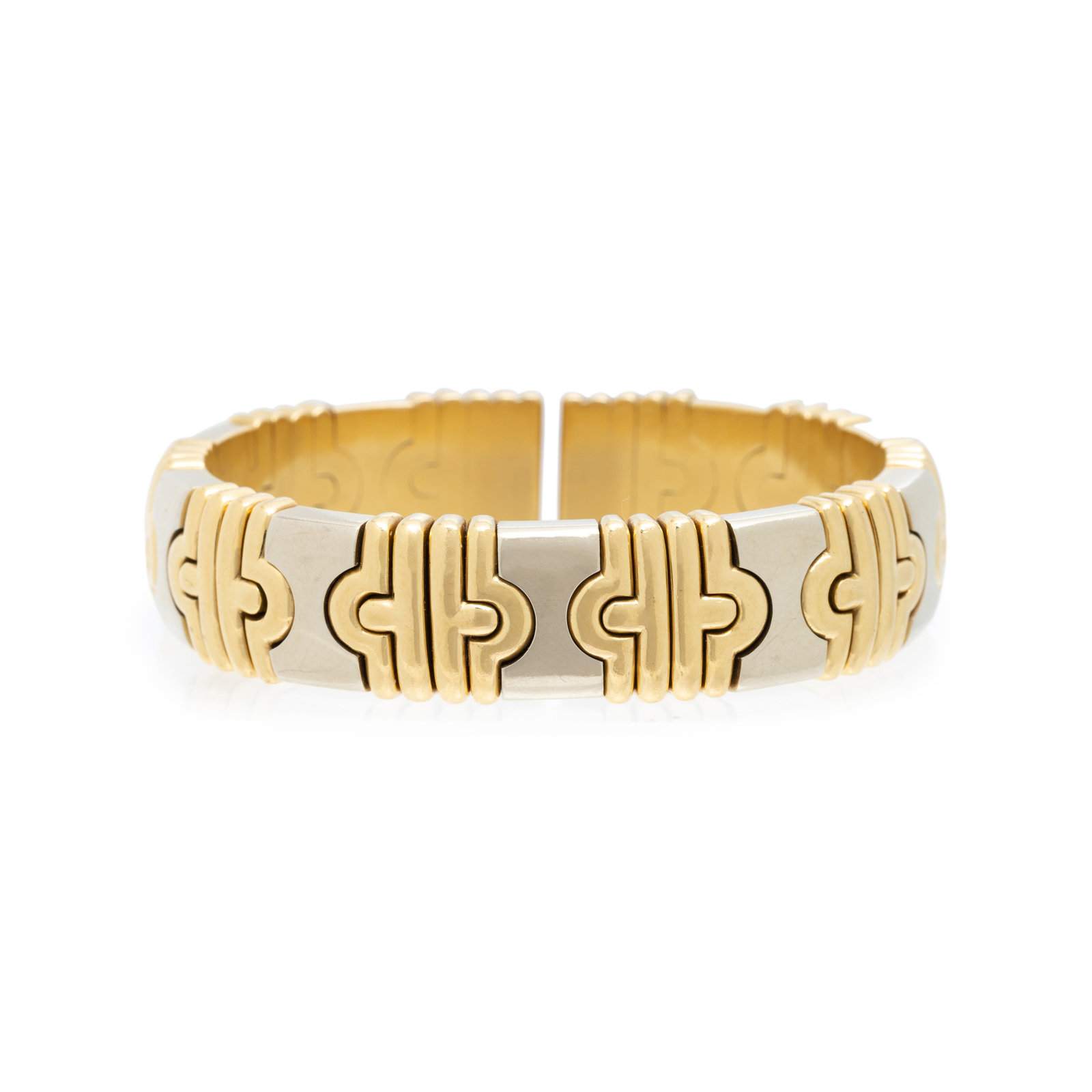 Appraisal: YELLOW GOLD AND STEEL CUFF BRACELET Consisting of a semi-flexible