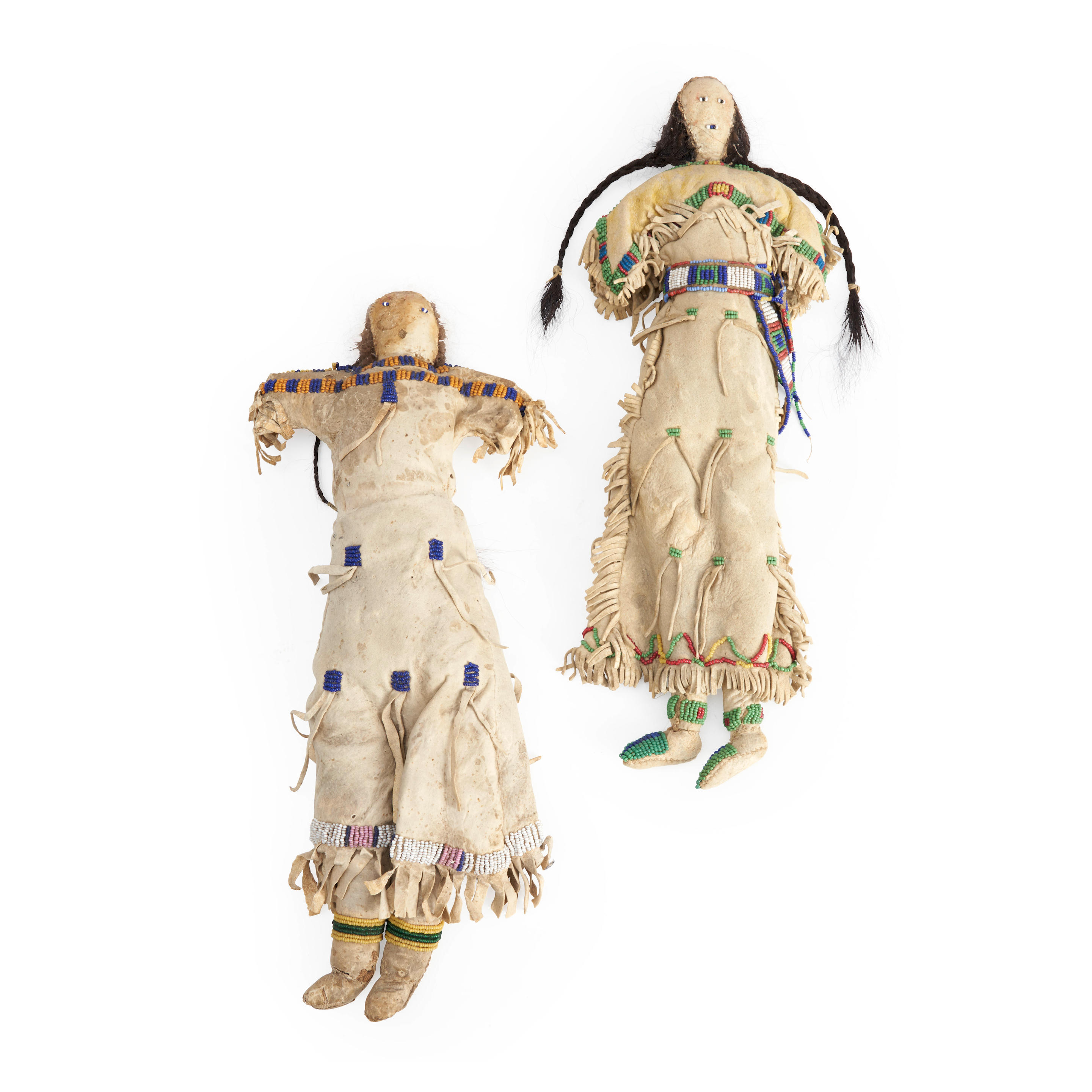 Appraisal: TWO PLAINS BEADED DOLLS Each dressed in buckskin clothing with