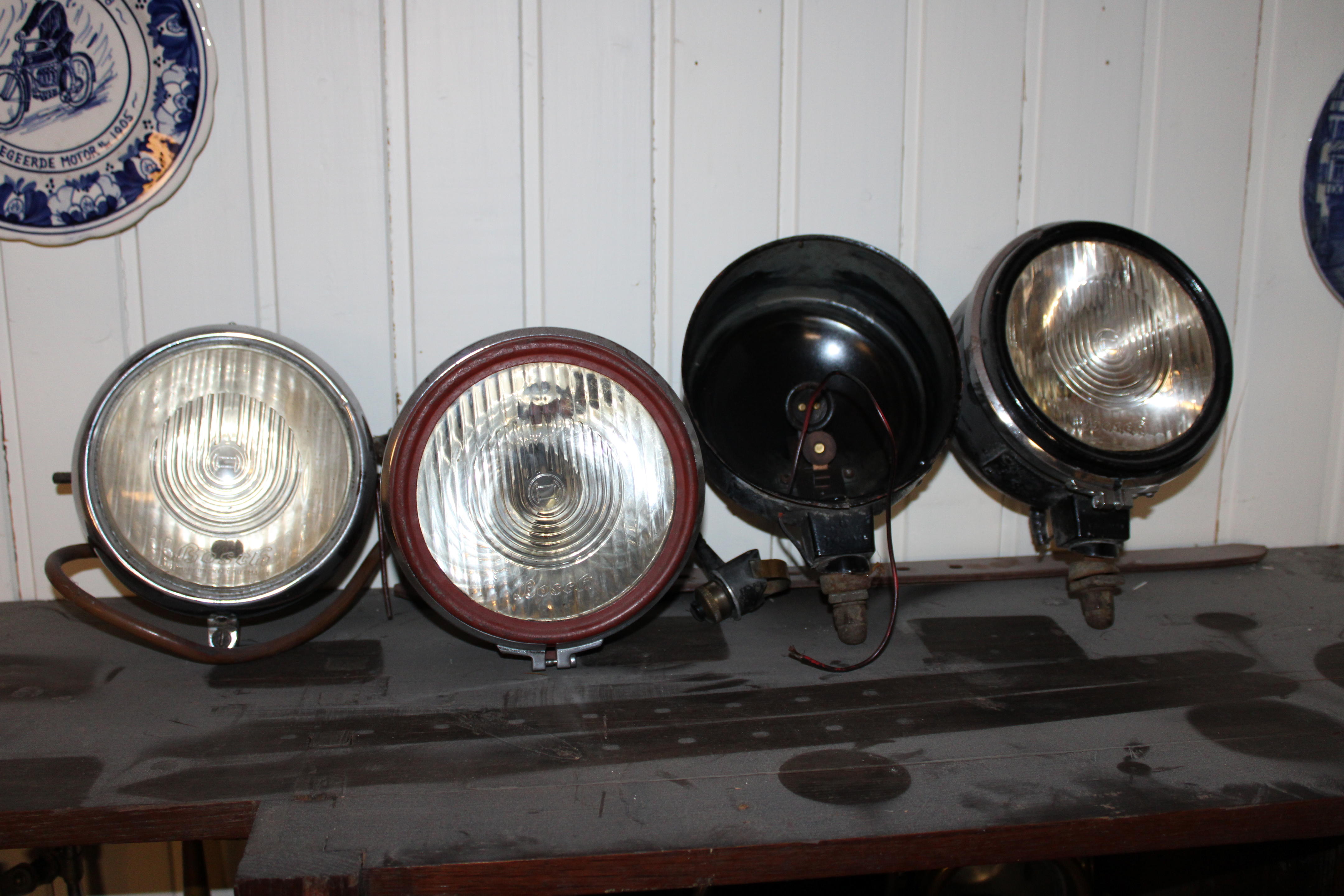 Appraisal: FOUR BOSCH ELECTRIC LAMPS comprising motorcycle headlamp with inch diameter