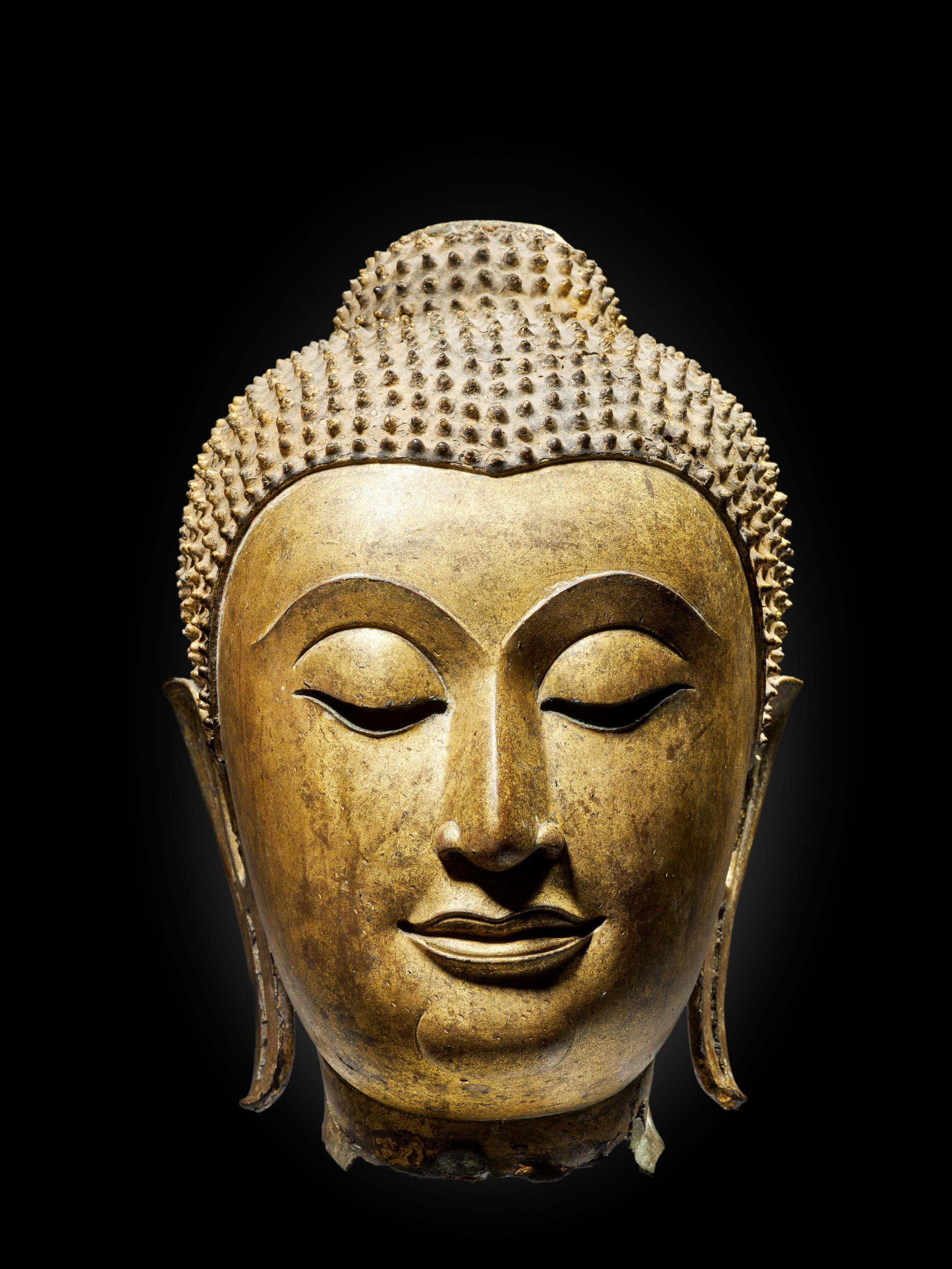 Appraisal: T TE DE BOUDDHA EN ALLIAGE DE CUIVRE LAQU OR