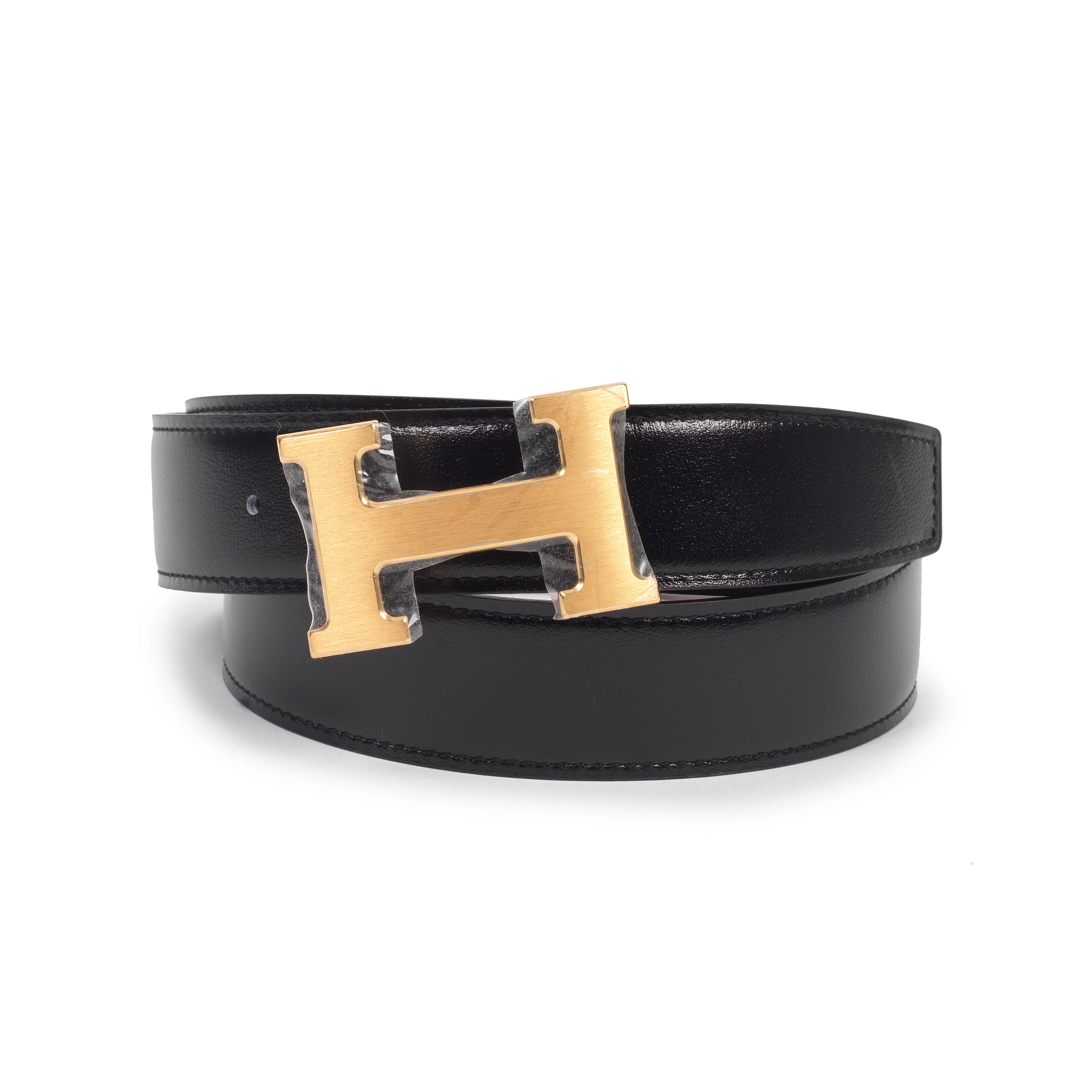 Appraisal: HERM S A BLACK AND GOLD REVERSIBLE CONSTANCE H BUCKLE