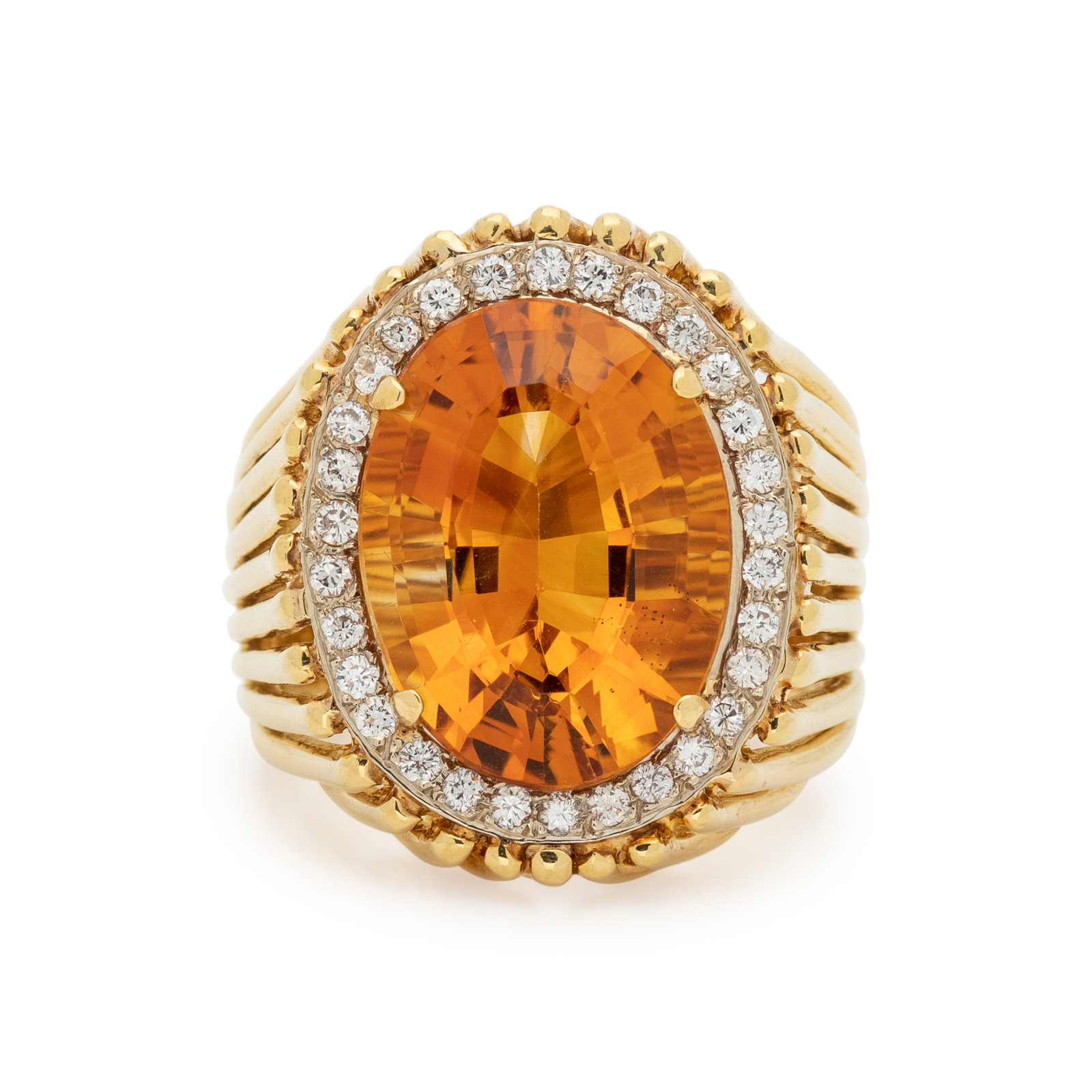 Appraisal: CITRINE AND DIAMOND RING Containing one oval mixed cut citrine