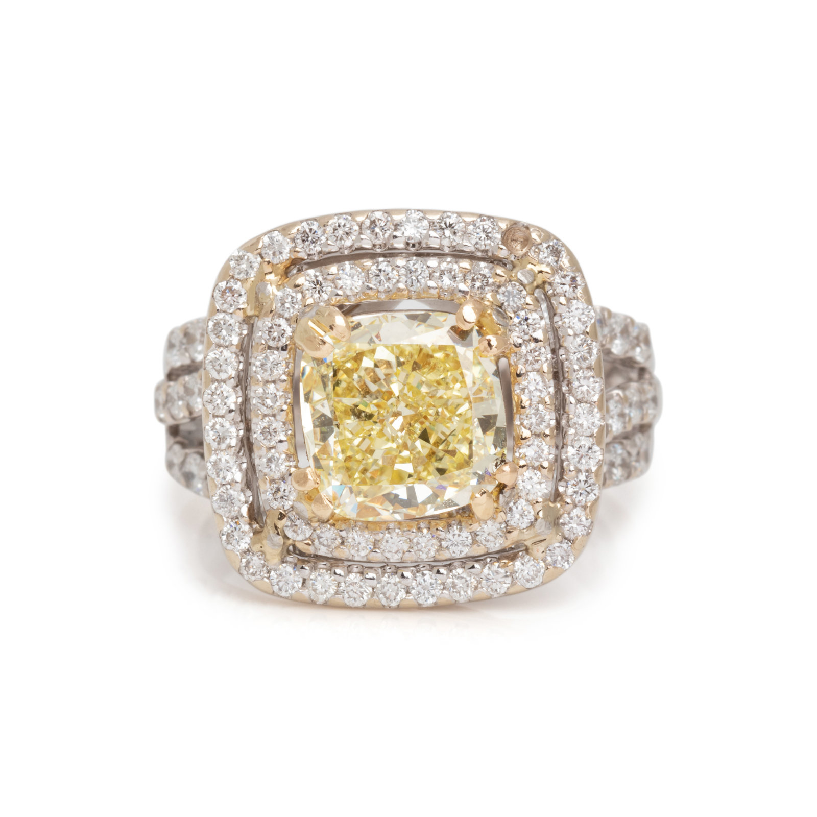 Appraisal: FANCY YELLOW DIAMOND AND DIAMOND RING Cushion modified brilliant cut