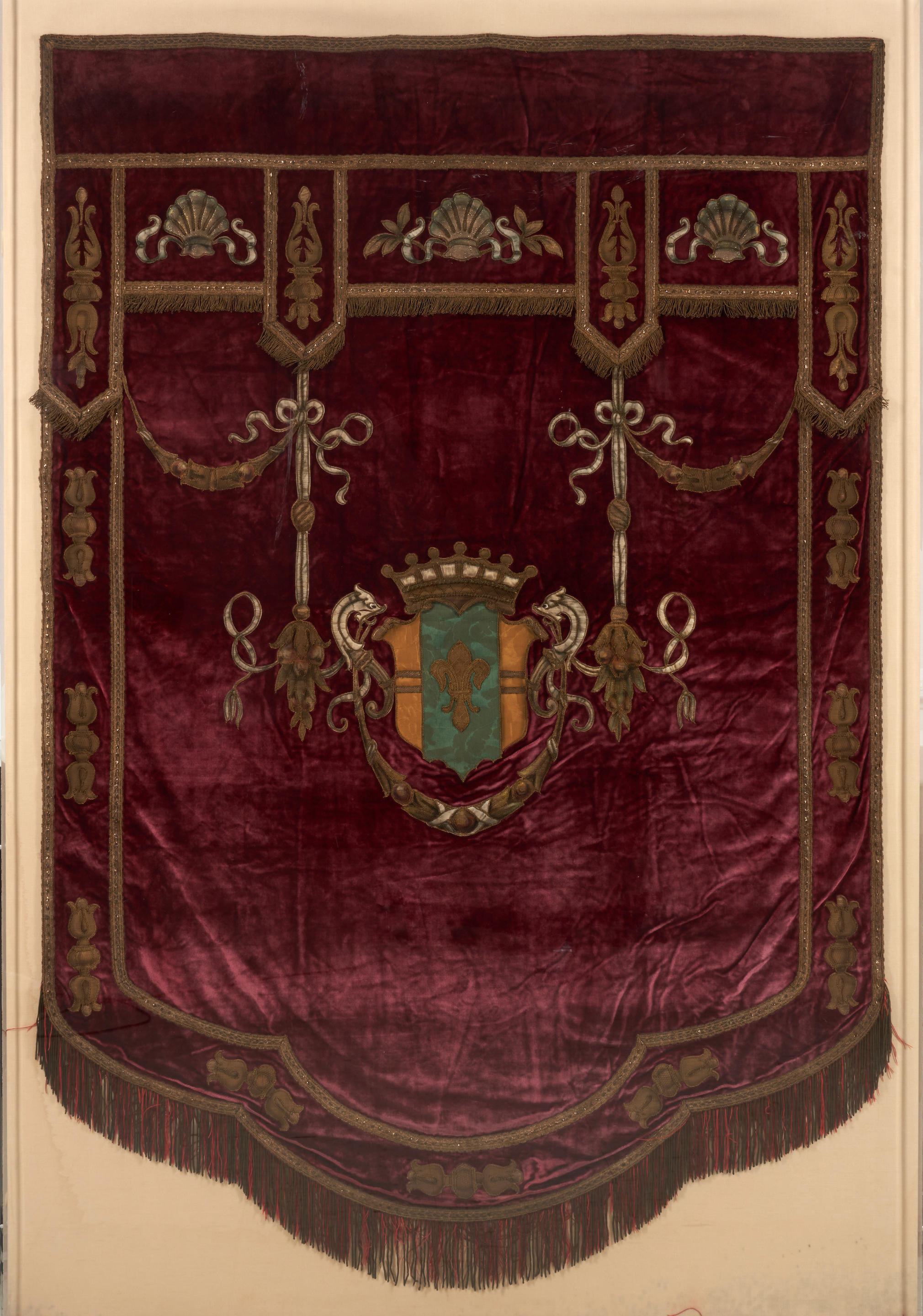 Appraisal: FRAMED EUROPEAN VELVET TEXTILE BANNER early th century fleur-de-lis crest