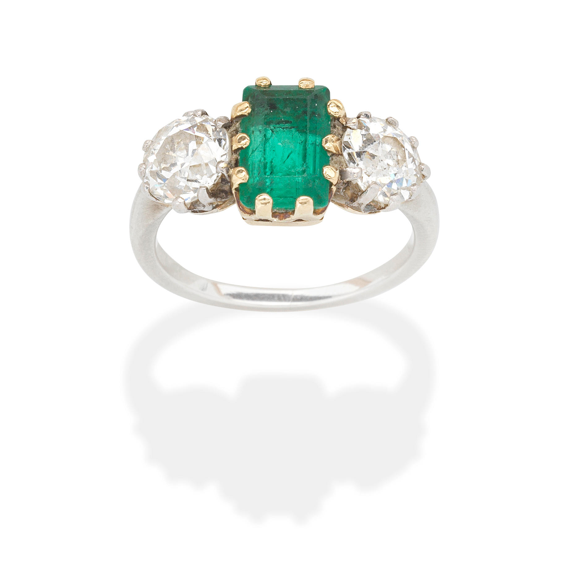 Appraisal: EMERALD AND DIAMOND THREE-STONE RING Step-cut emerald approx cts Old