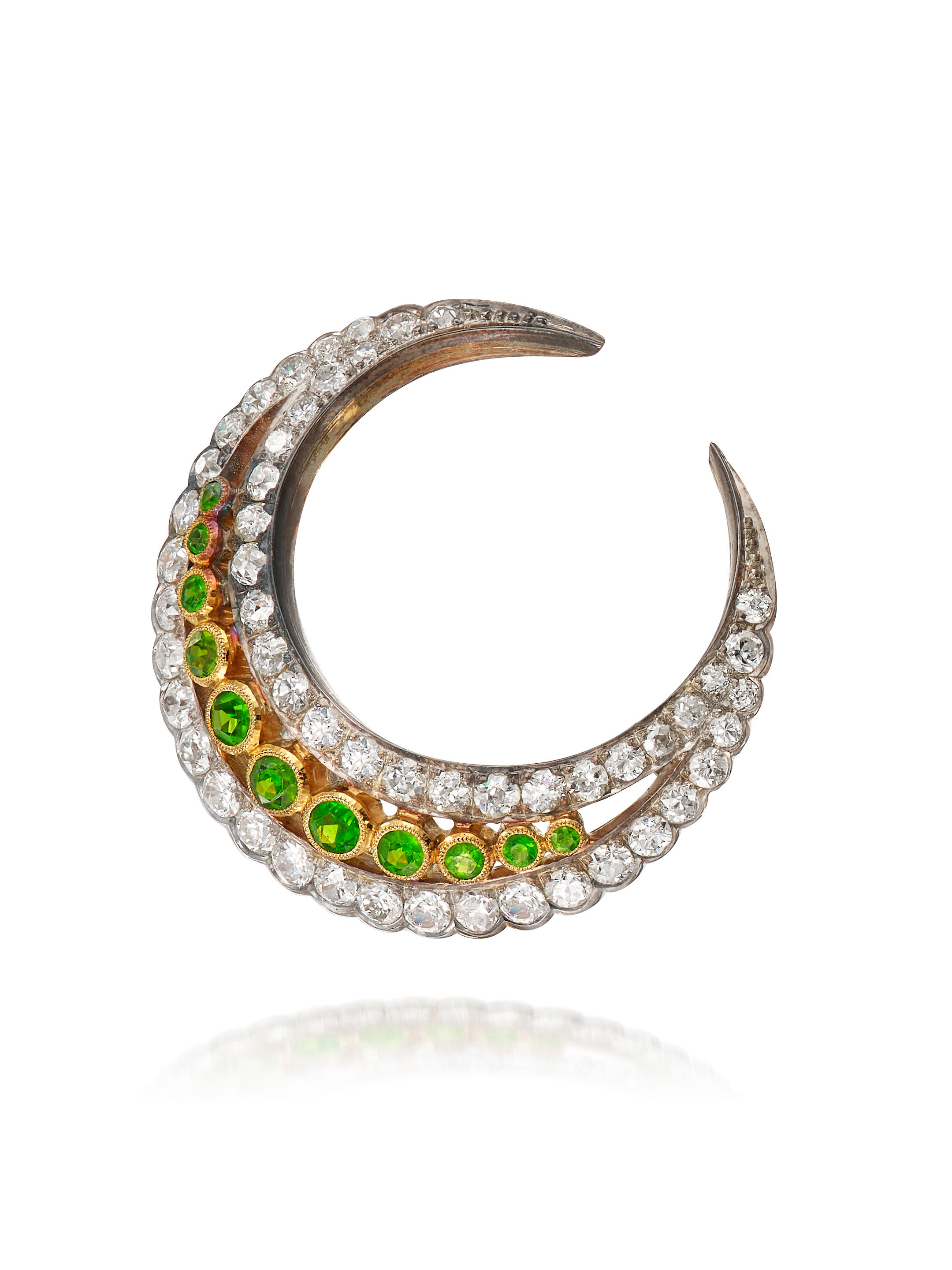 Appraisal: DEMANTOID GARNET AND DIAMOND 'CRESCENT' BROOCH Diamonds approx cts Metal