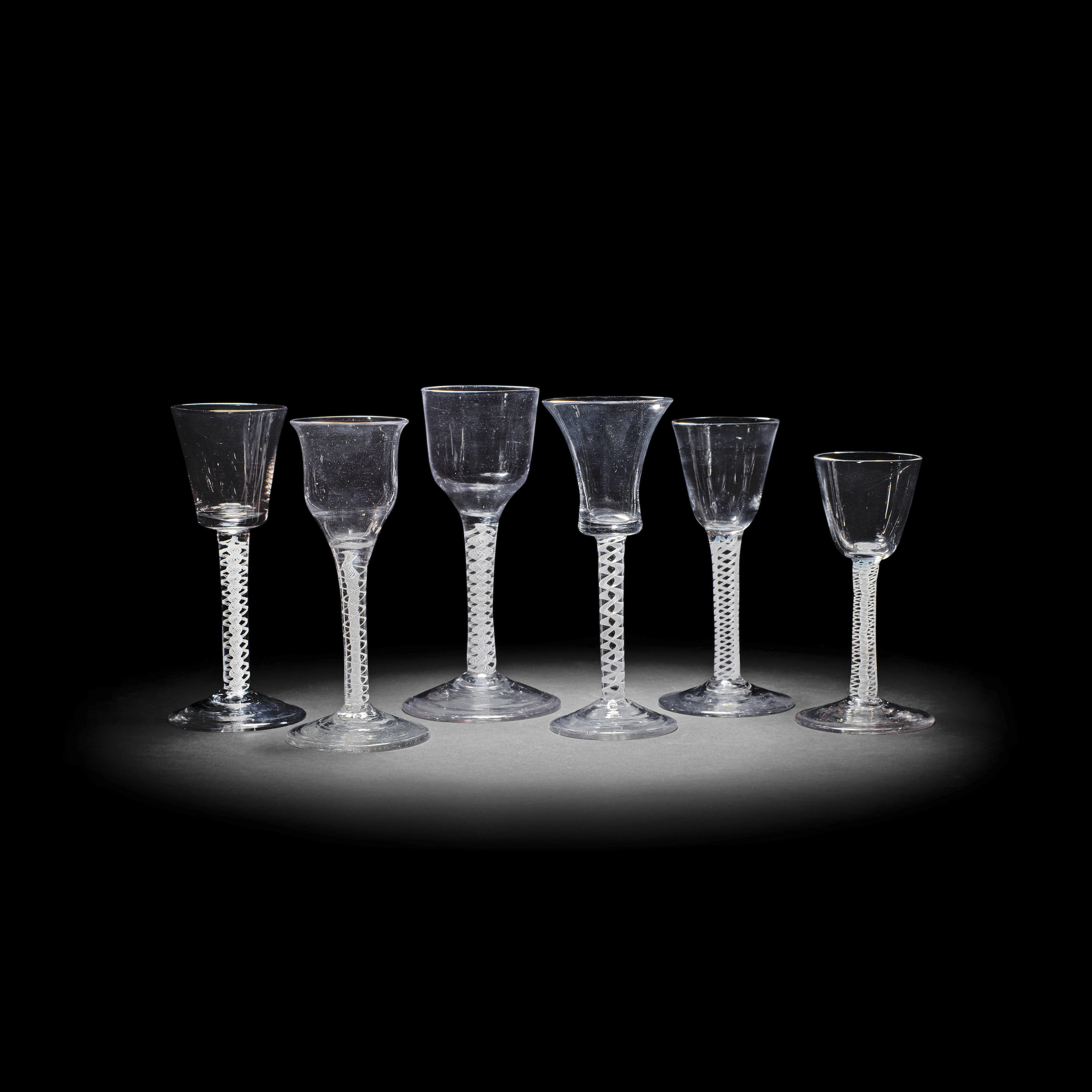 Appraisal: SIX OPAQUE TWIST WINE GLASSES CIRCA Comprising two single-series examples