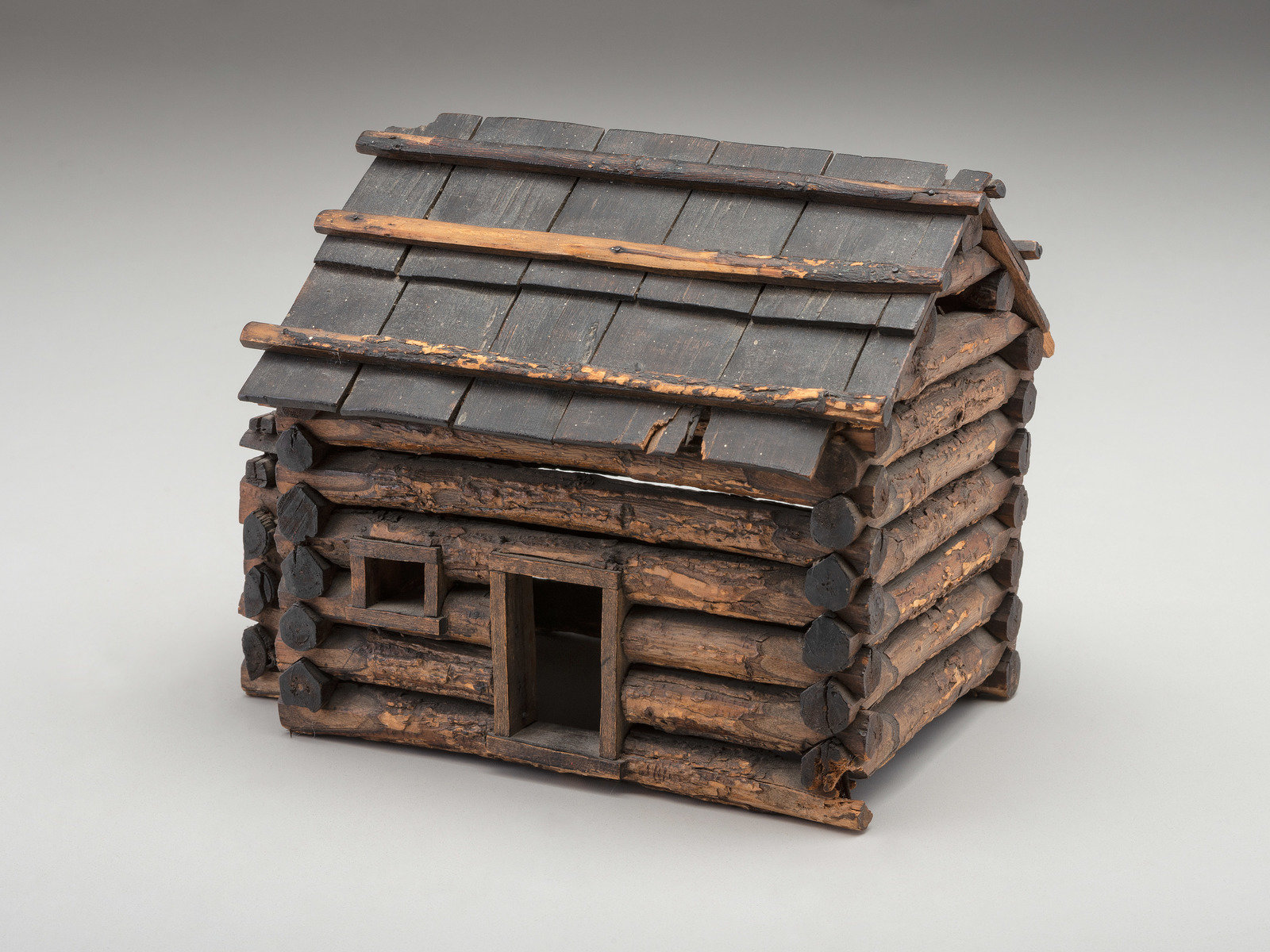 Appraisal: LINCOLN Abraham - Folk art log cabin depicting Abraham Lincoln's