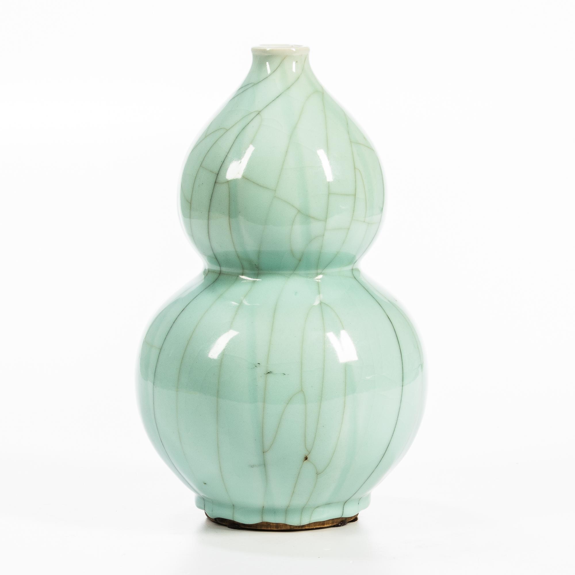 Appraisal: CELADON CRACKLE-GLAZED DOUBLE GOURD VASE China th century resting on