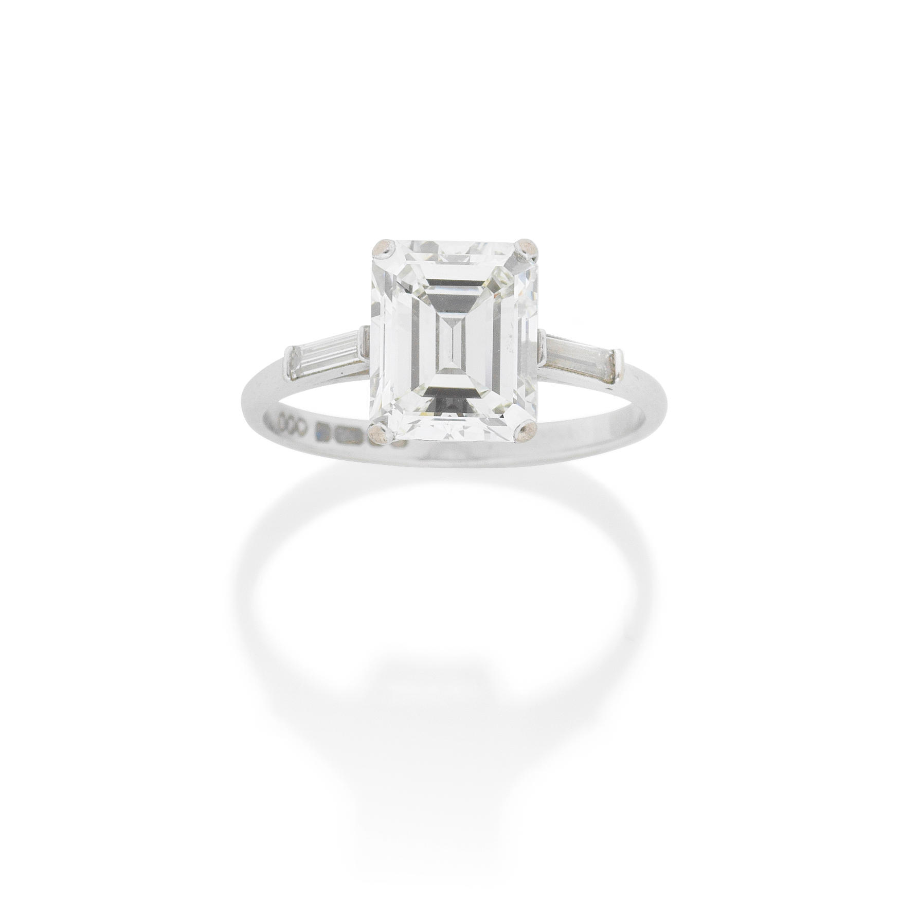 Appraisal: DIAMOND SINGLE-STONE RING The step-cut diamond weighing carats between baguette-cut