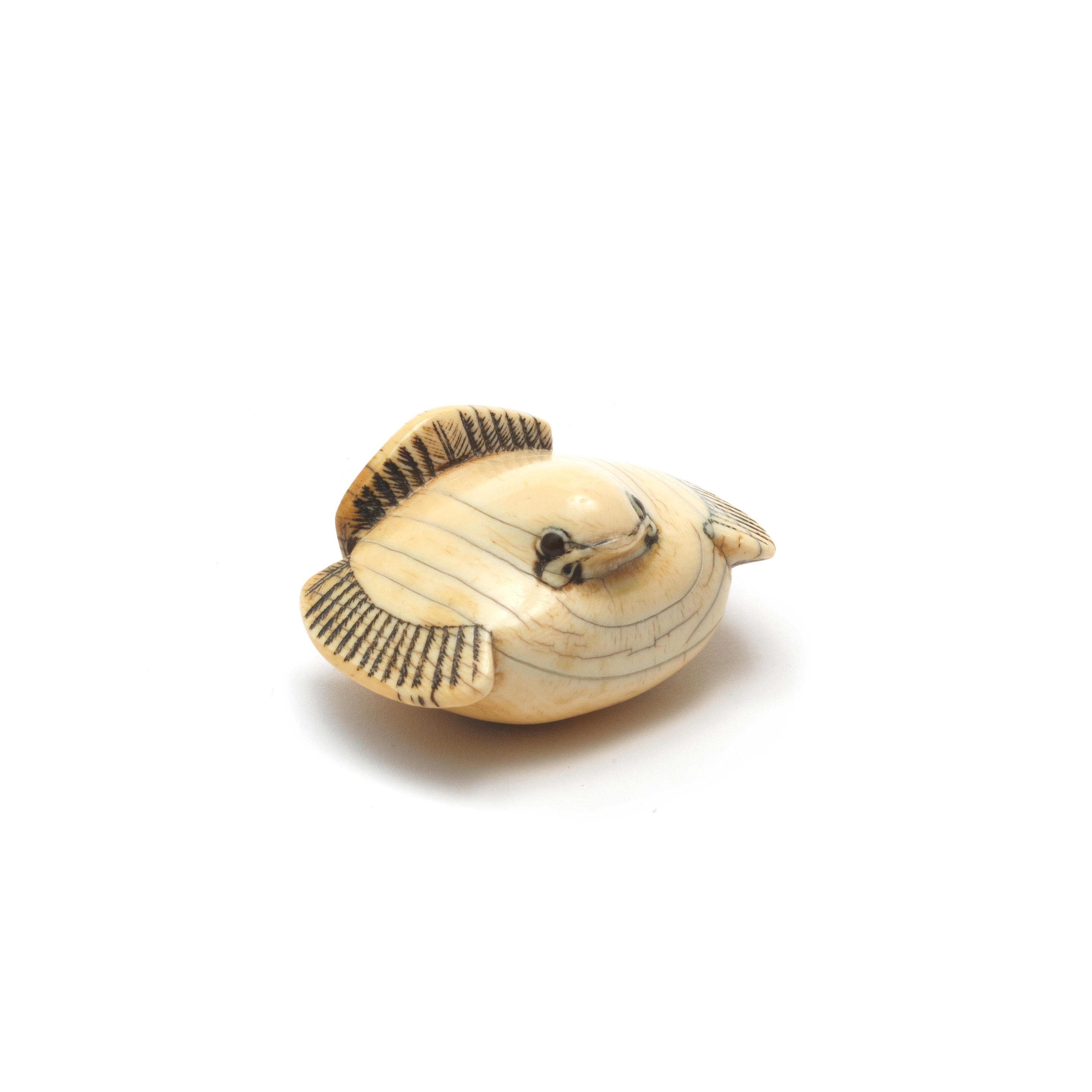 Appraisal: AN IVORY NETSUKE OF A STYLISED SPARROW After Masanao of