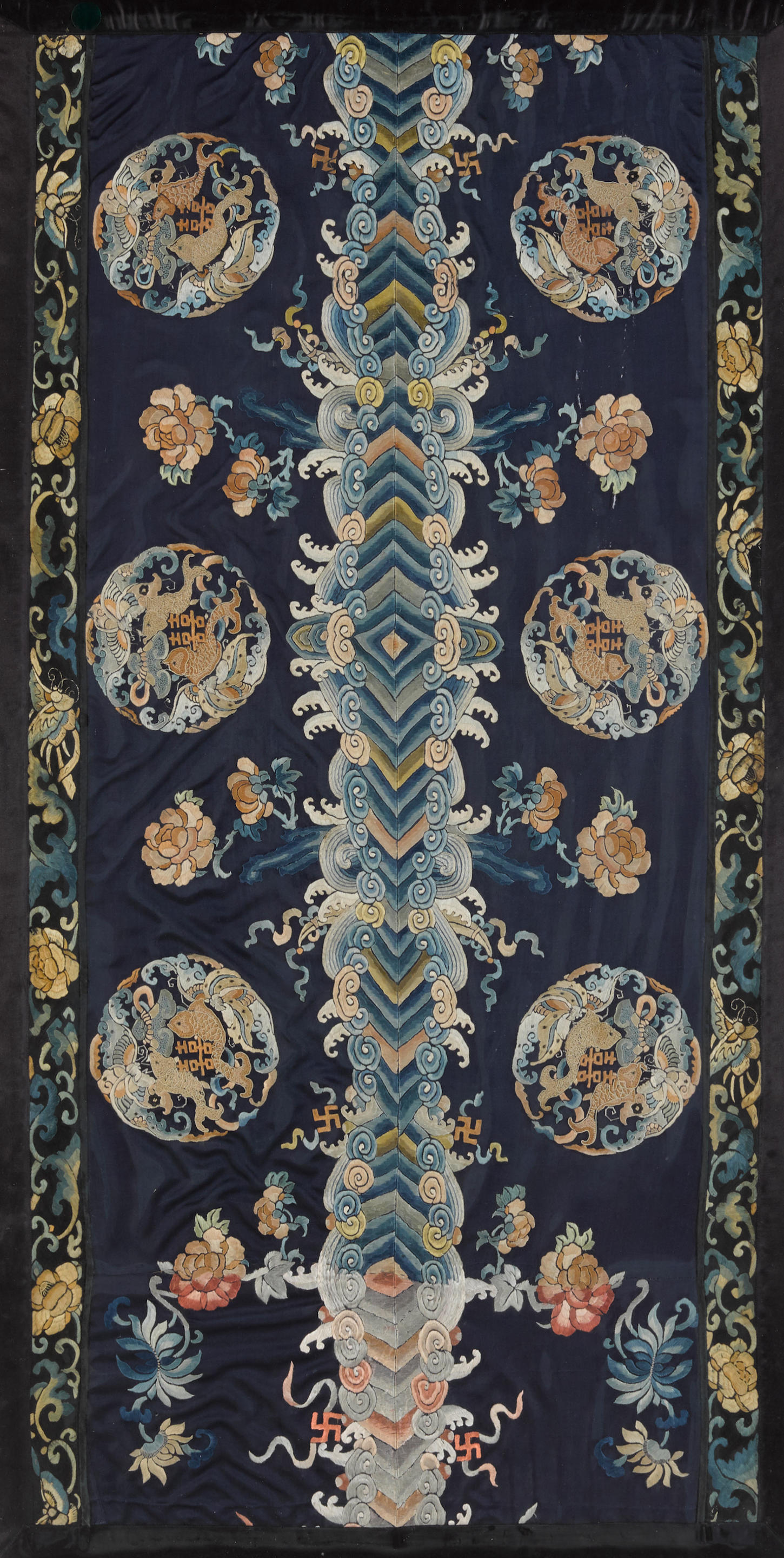 Appraisal: AN EMBROIDERED NAVY-GROUND SILK PANEL th century Rectangular and vertically