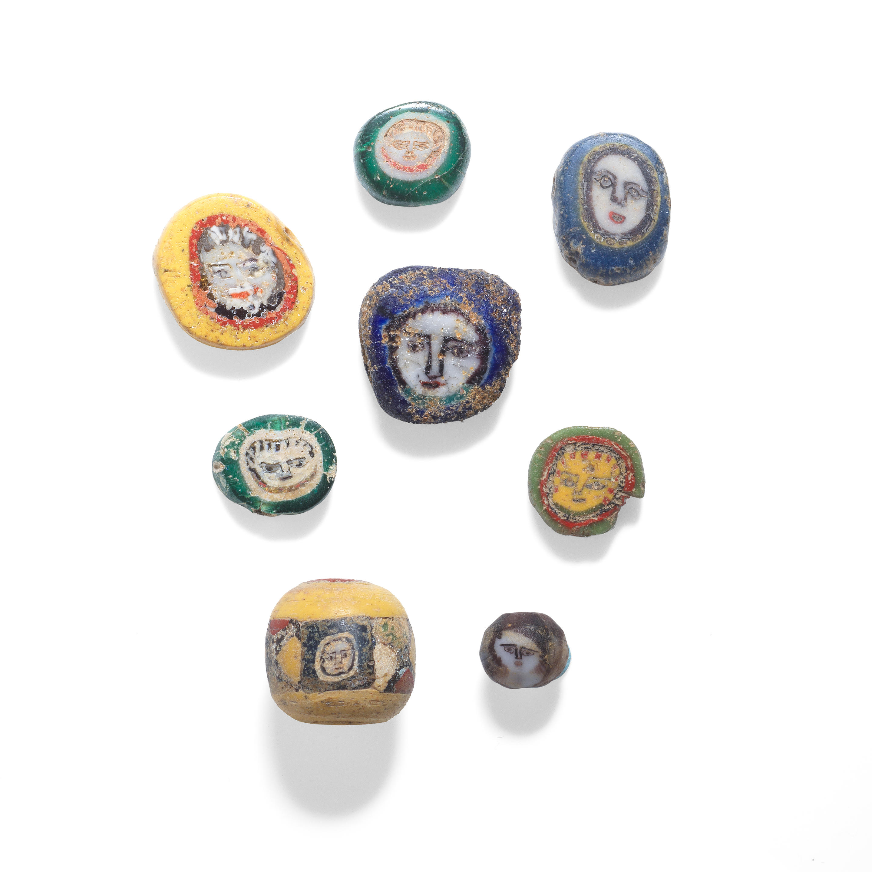 Appraisal: A GROUP OF EIGHT ROMAN GLASS FACE BEADS A group