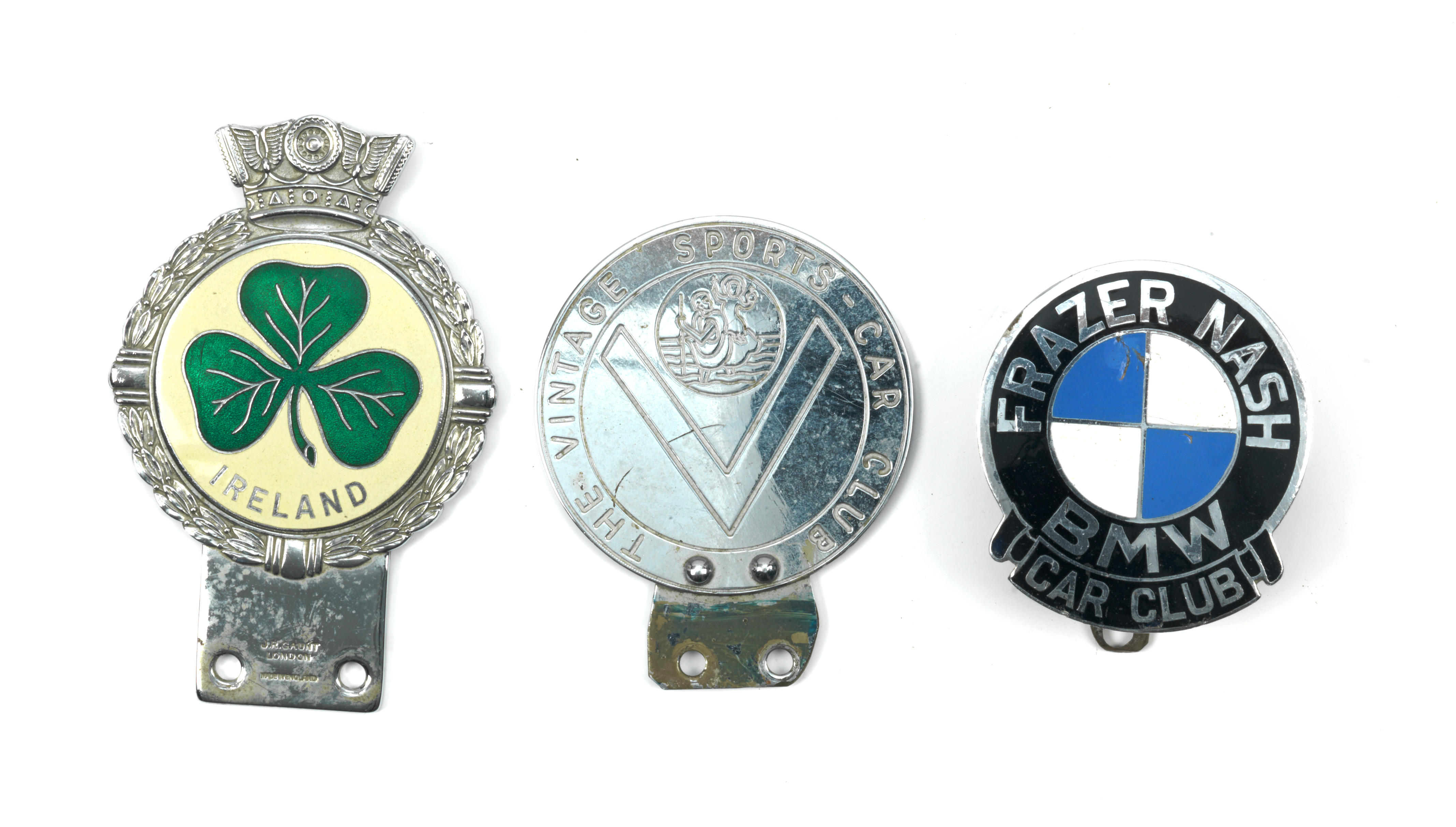 Appraisal: THREE CAR BADGES comprising Ireland by J R Gaunt chromed