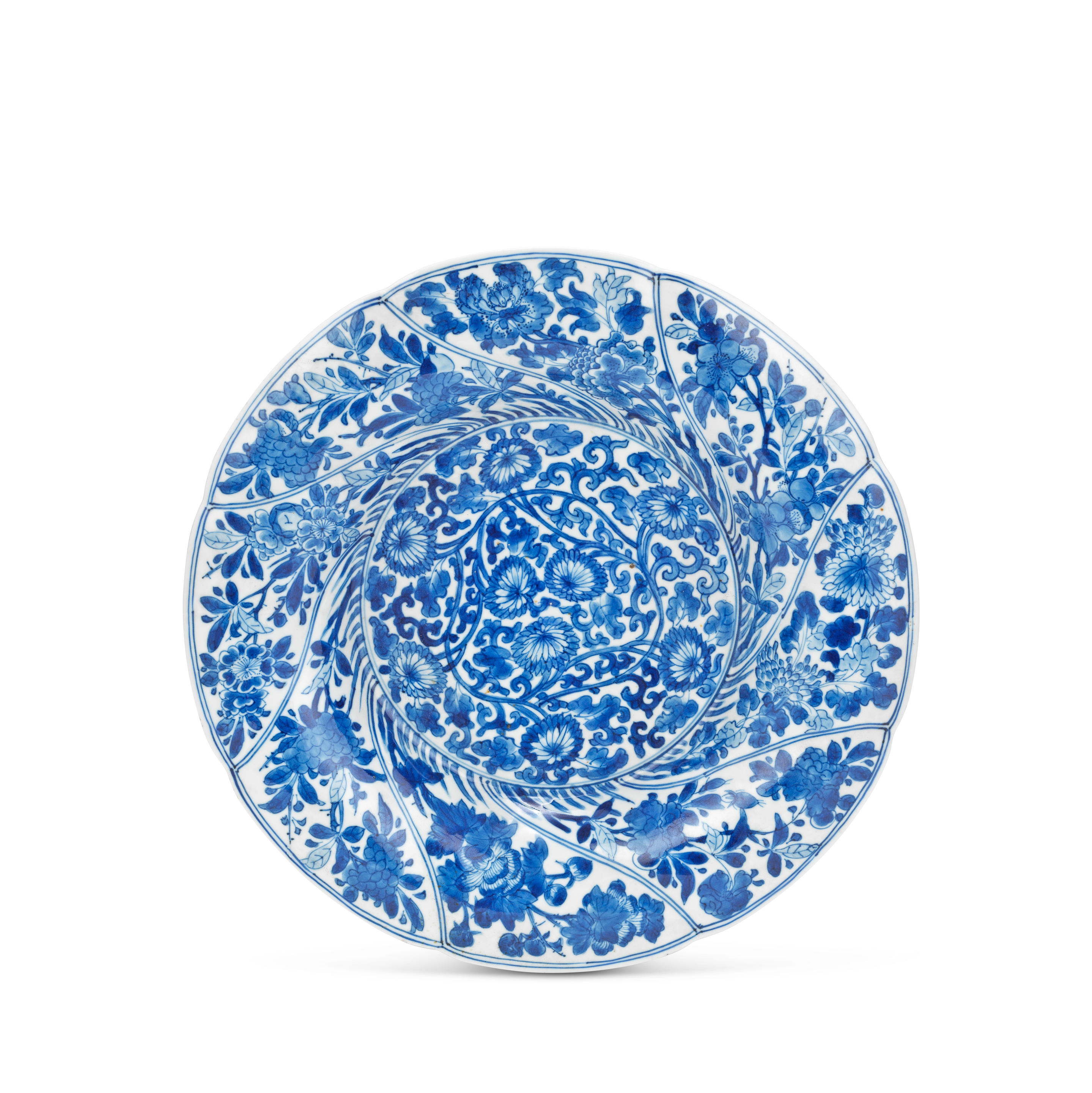 Appraisal: A BLUE AND WHITE SPIRAL MOULDED PLATE Kangxi Decorated to