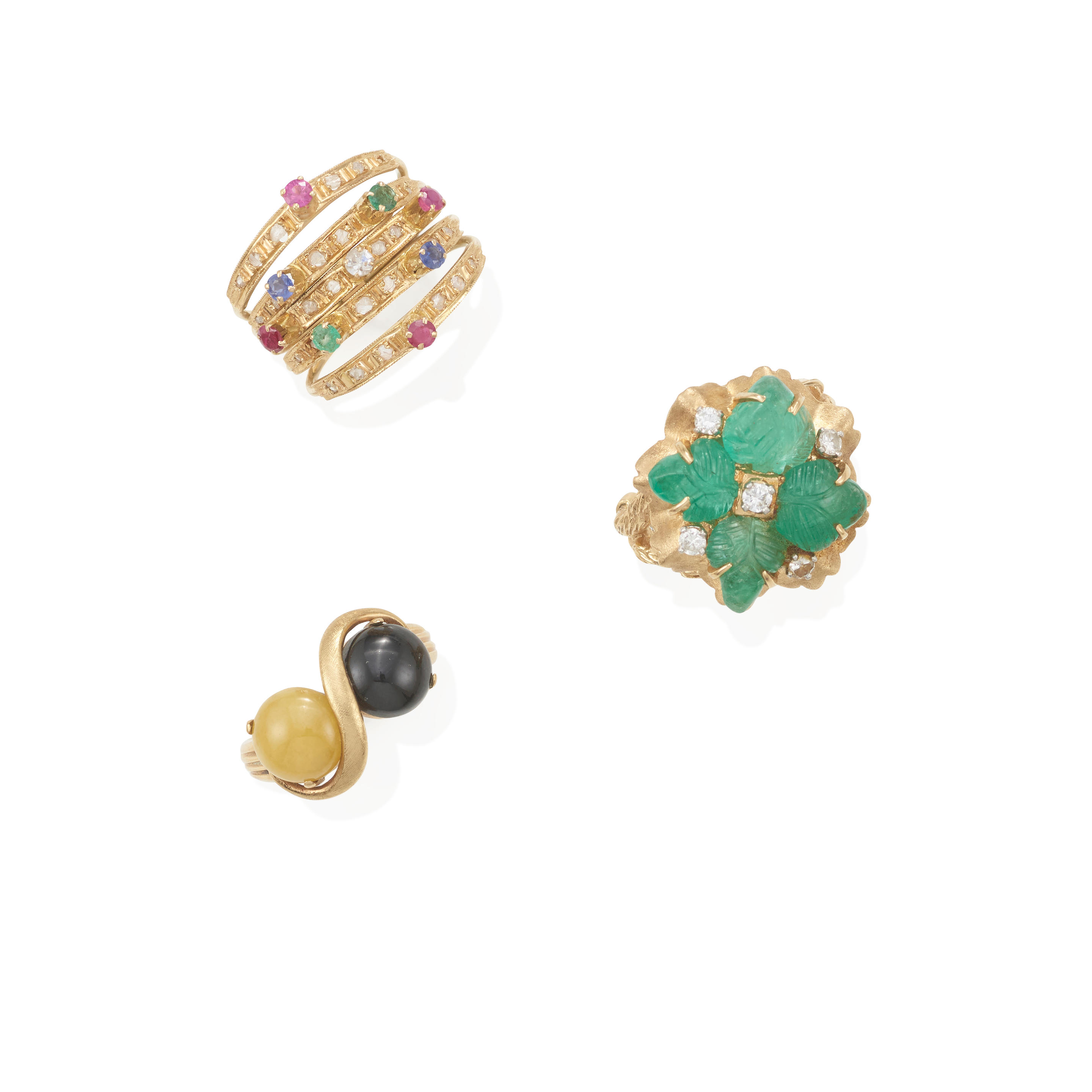 Appraisal: THREE GOLD AND GEM-SET RINGS Diamonds emeralds sapphires rubies jade