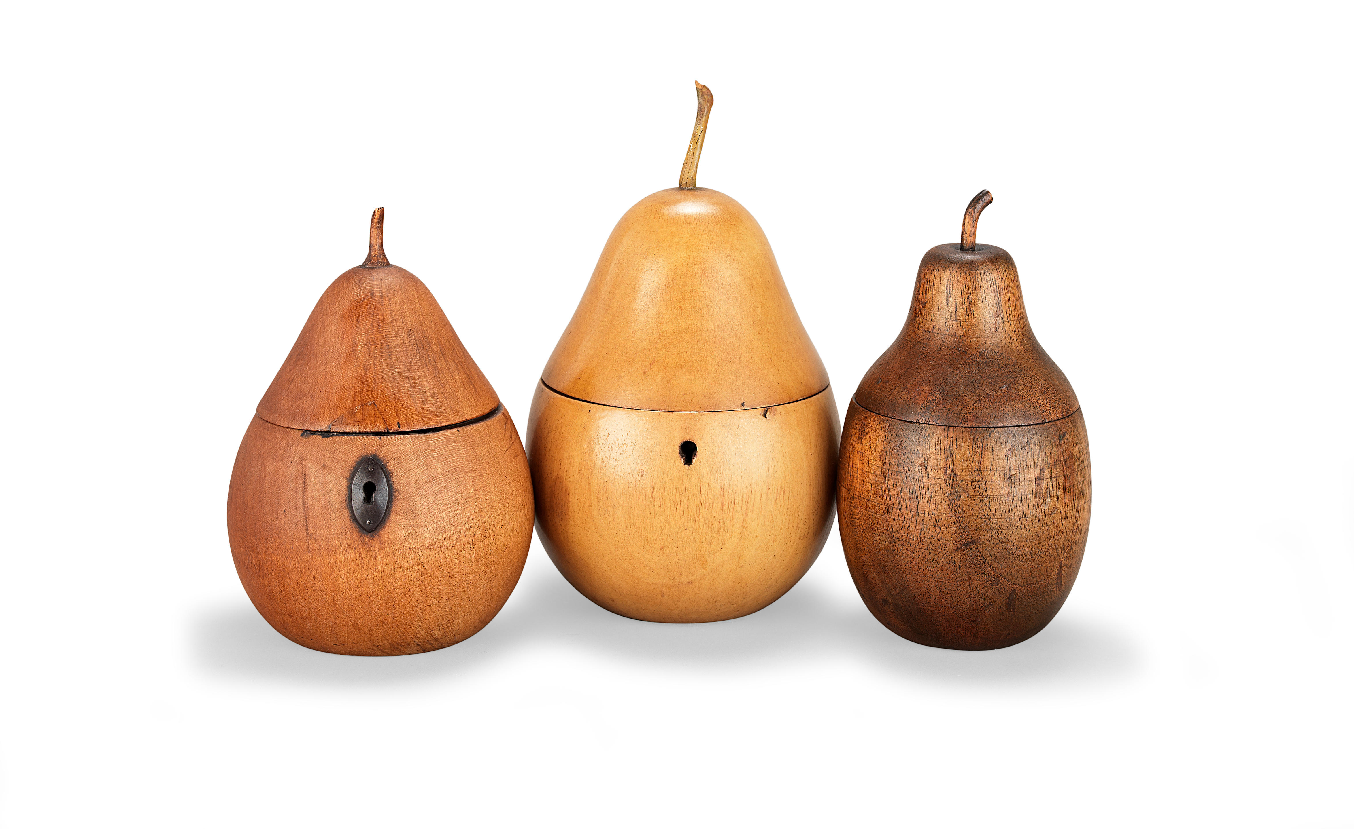 Appraisal: THREE TURNED FRUITWOOD TEA CADDIES All modelled as pears with