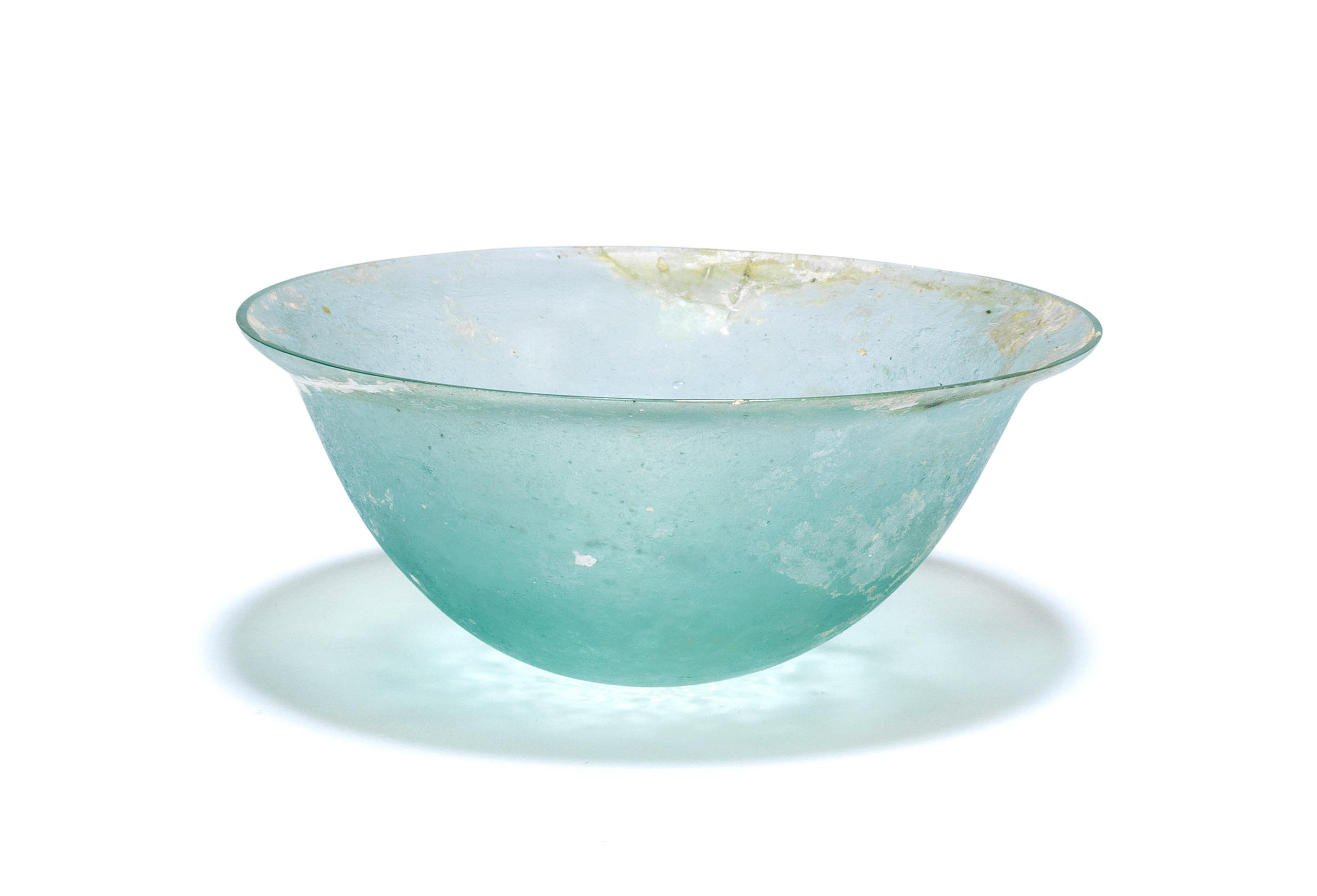 Appraisal: A SMALL HELLENISTIC PALE BLUE GLASS BOWL A small Hellenistic