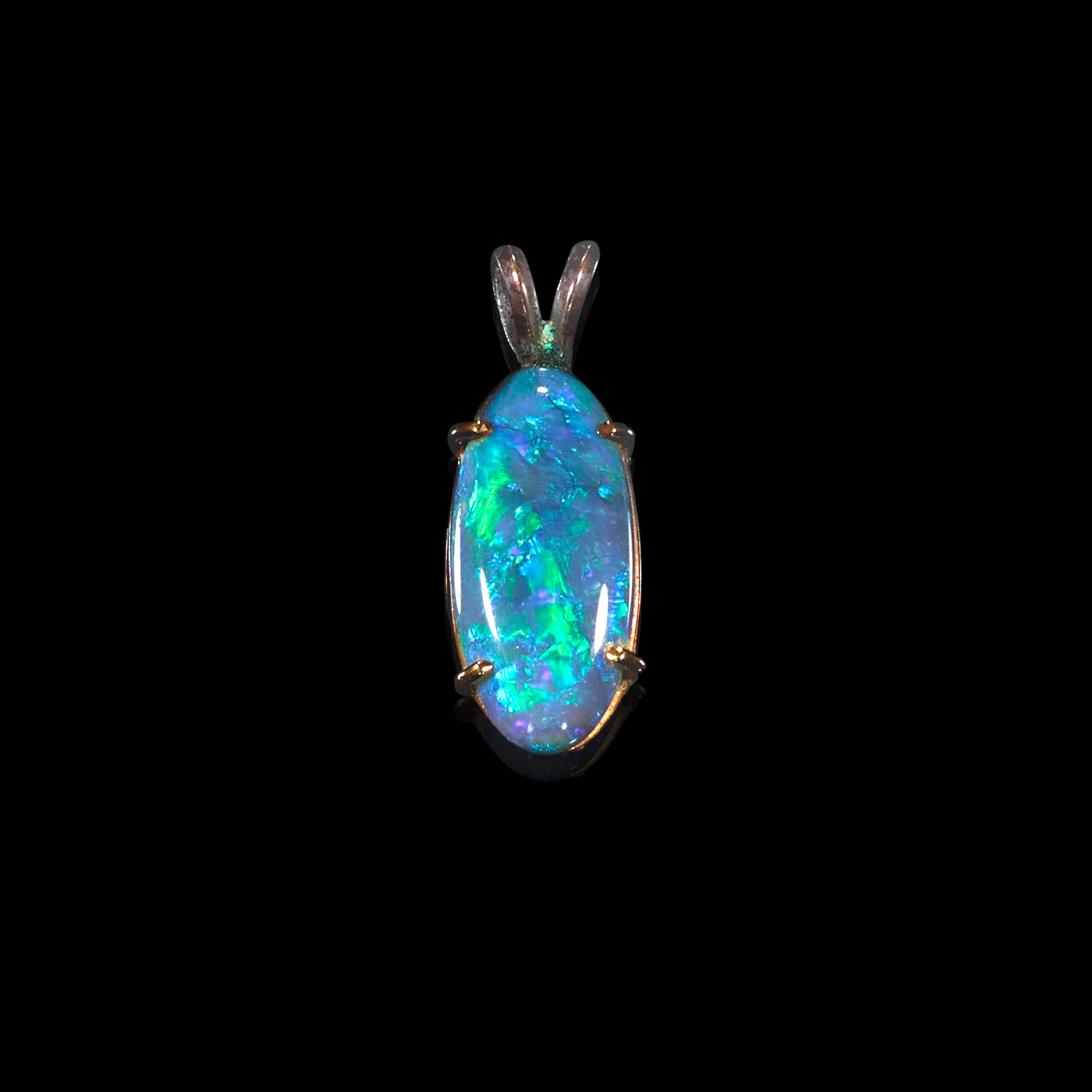 Appraisal: BLACK OPAL PENDANT Australia An oval black opal cabochon displaying