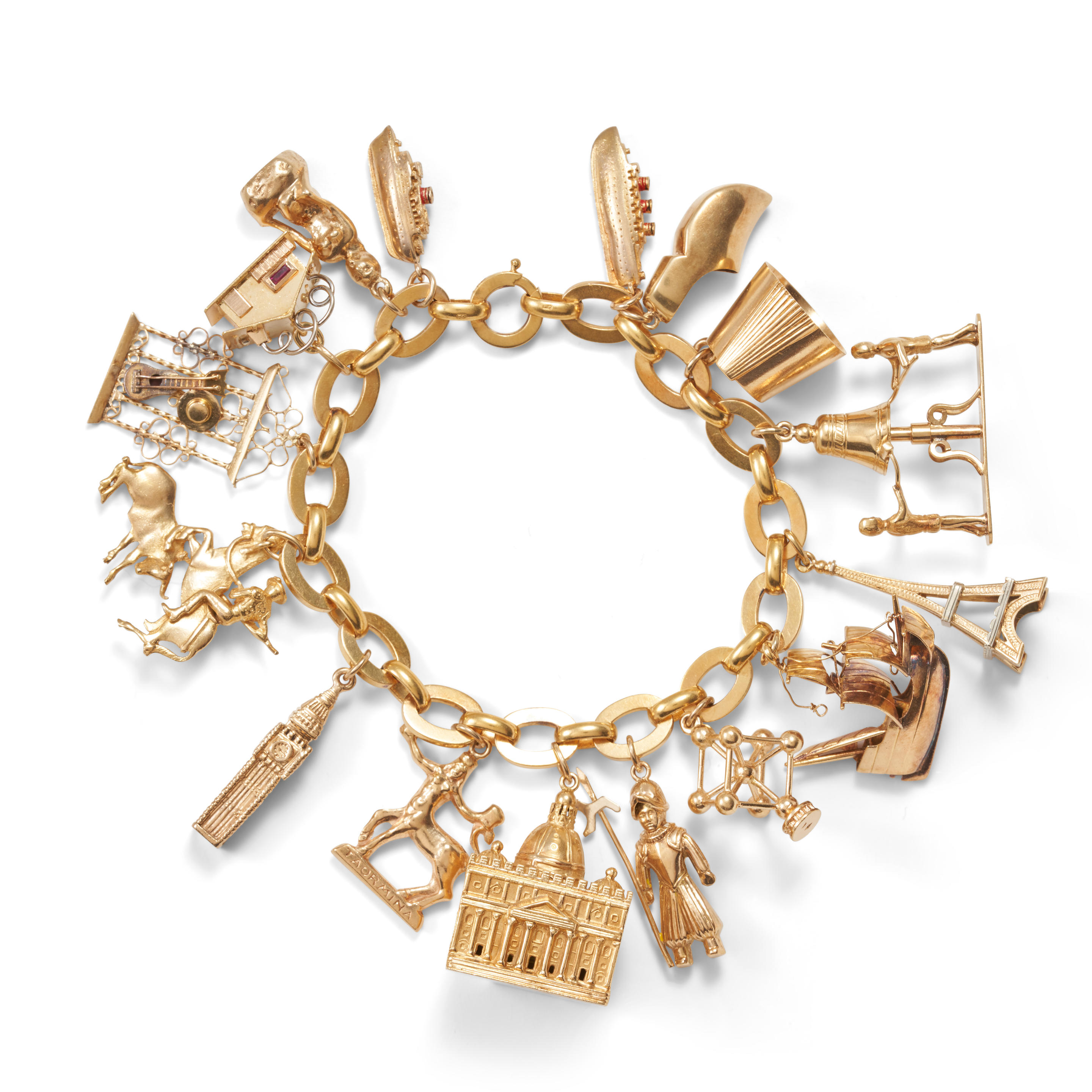 Appraisal: A GOLD CHARM BRACELET The k gold bracelet suspending traveler's