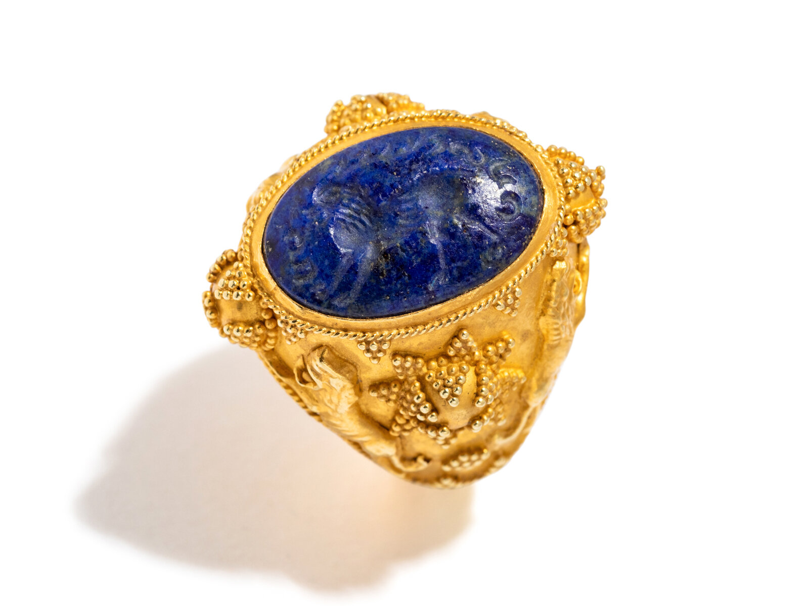 Appraisal: YELLOW GOLD AND LAPIS LAZULI RING Carved lapis lazuli Sasanian