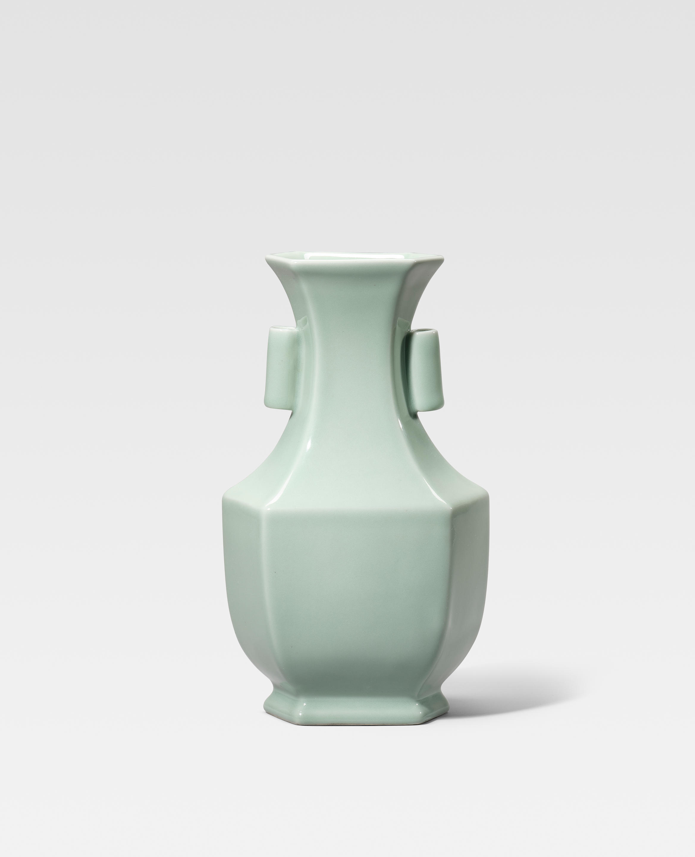 Appraisal: A FINE AND RARE CELADON-GLAZED OBLONG HEXAGONAL VASE Yongzheng seal